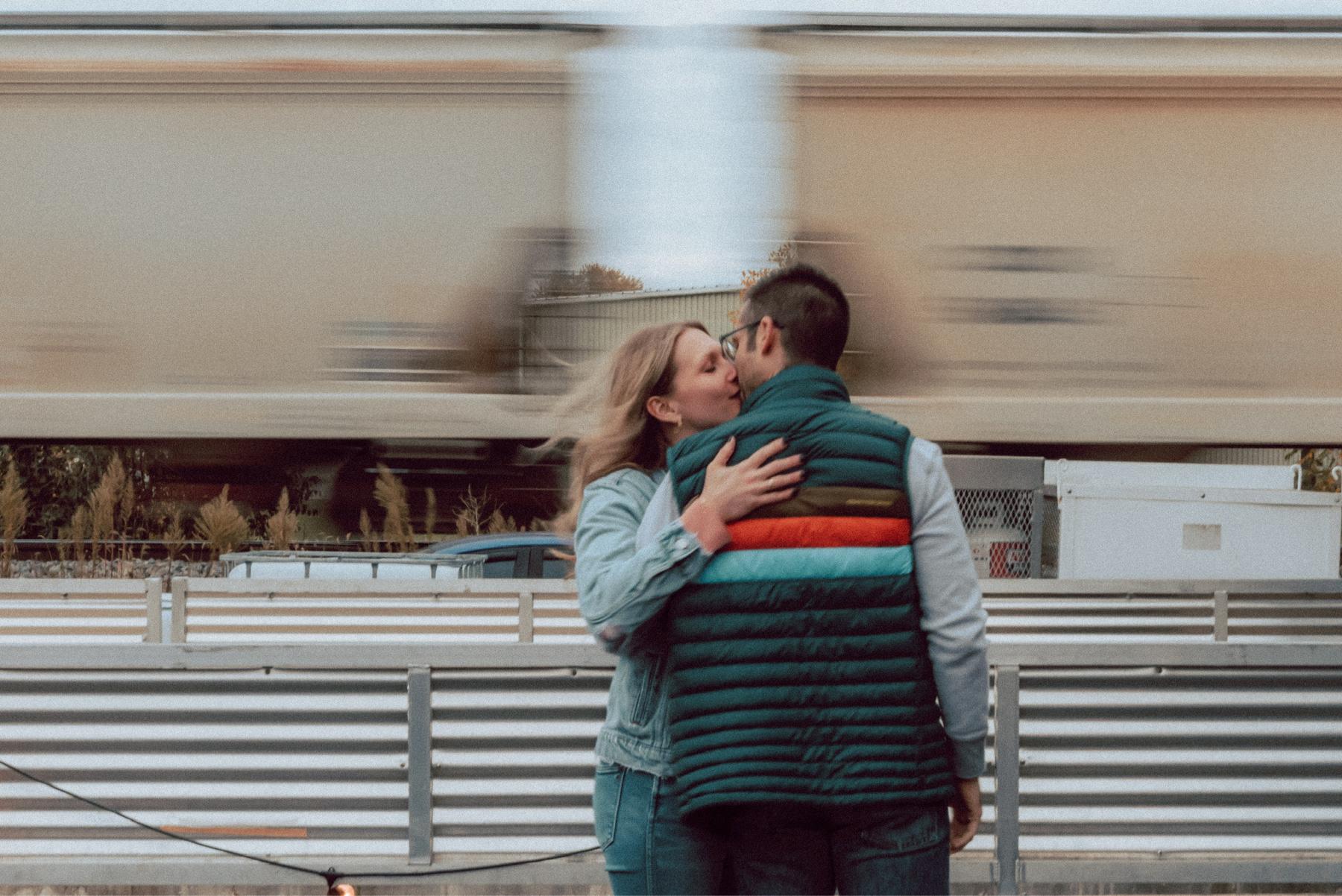 Stealing a kiss by the tracks outside the brewery.