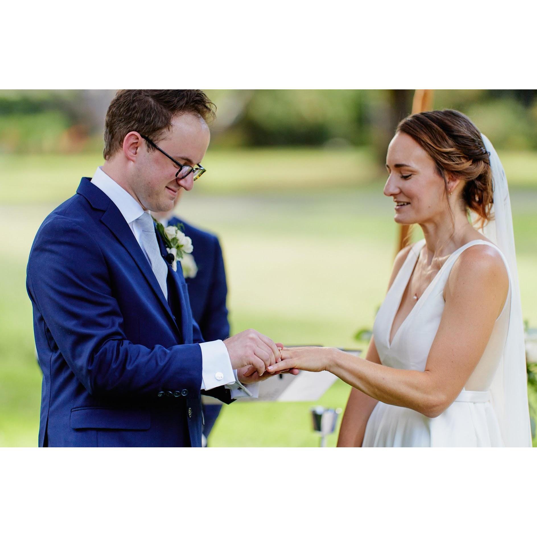 Steve placing the ring on Rachel's hand