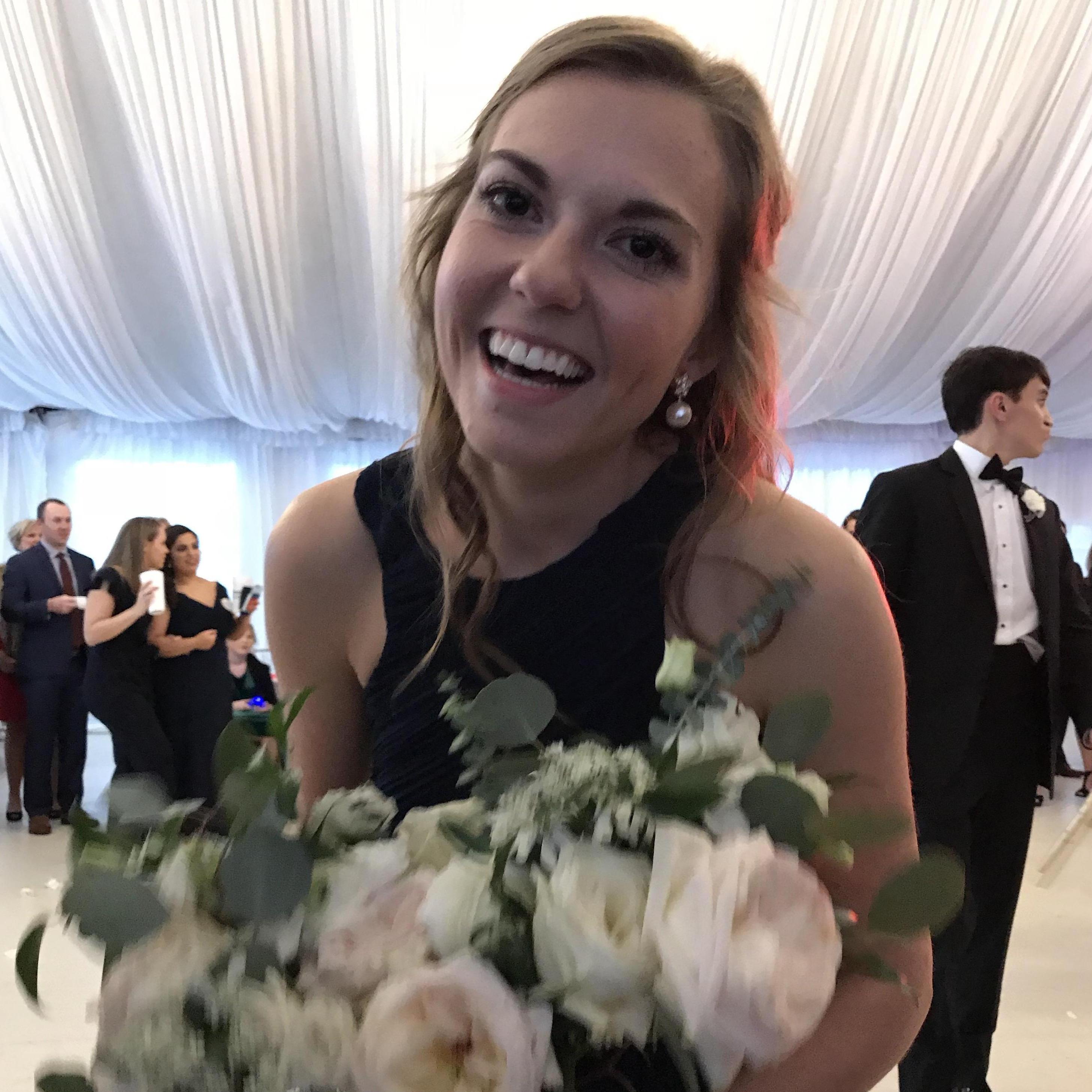 Logan snapped this pic of Lauren after she caught the bouquet for the THIRD time in a row. Logan proposed 2 months after this pic was taken.