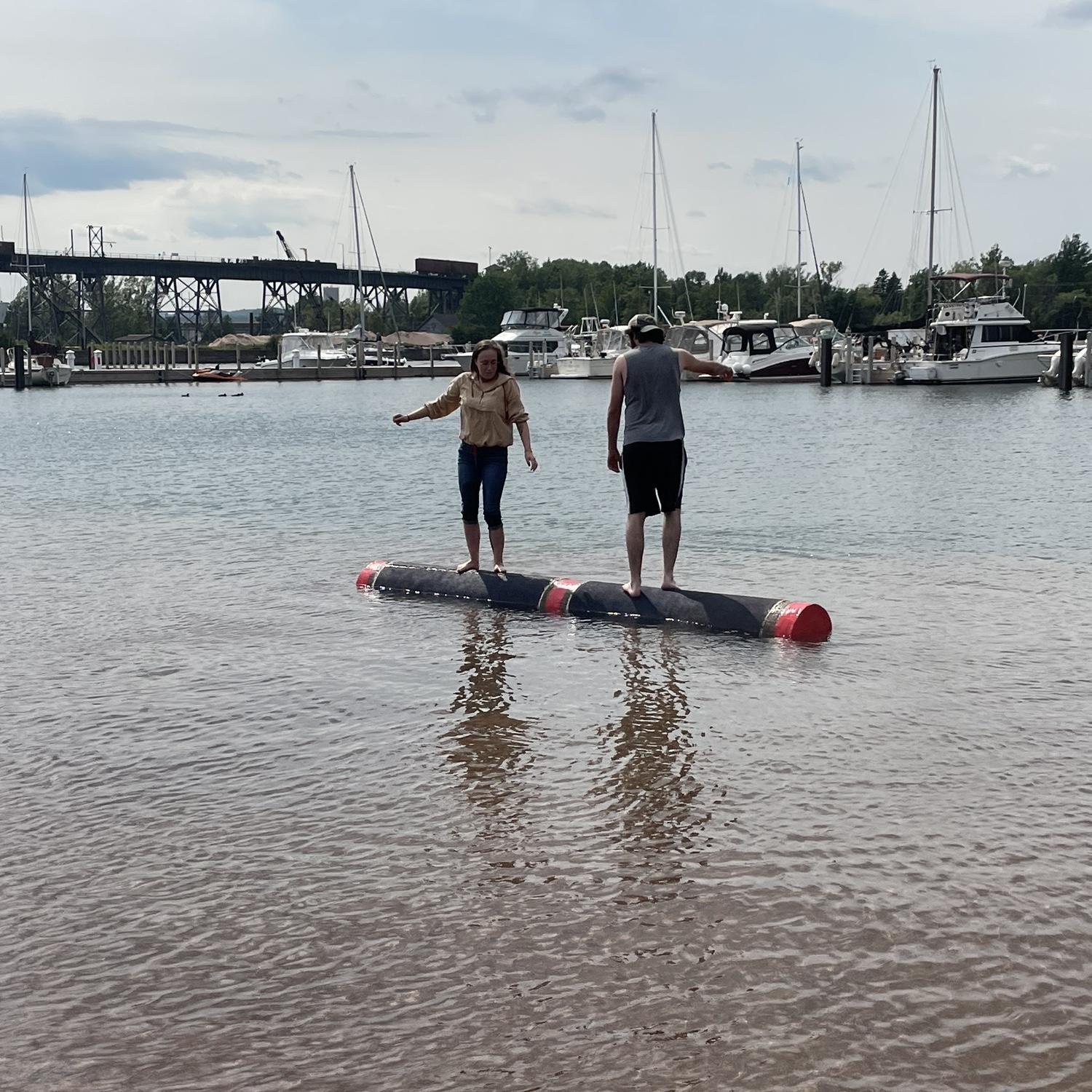 Sam teaching Ashley his family’s favorite past time, log rolling.