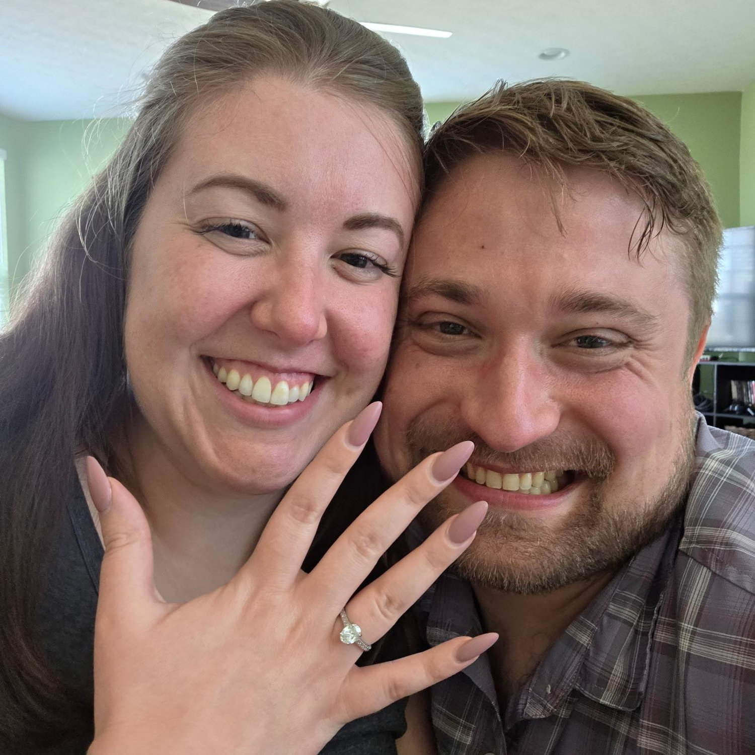 Immediately after Kevin proposed and Emily said yes. Not pictured, our cats screaming at each other in the background