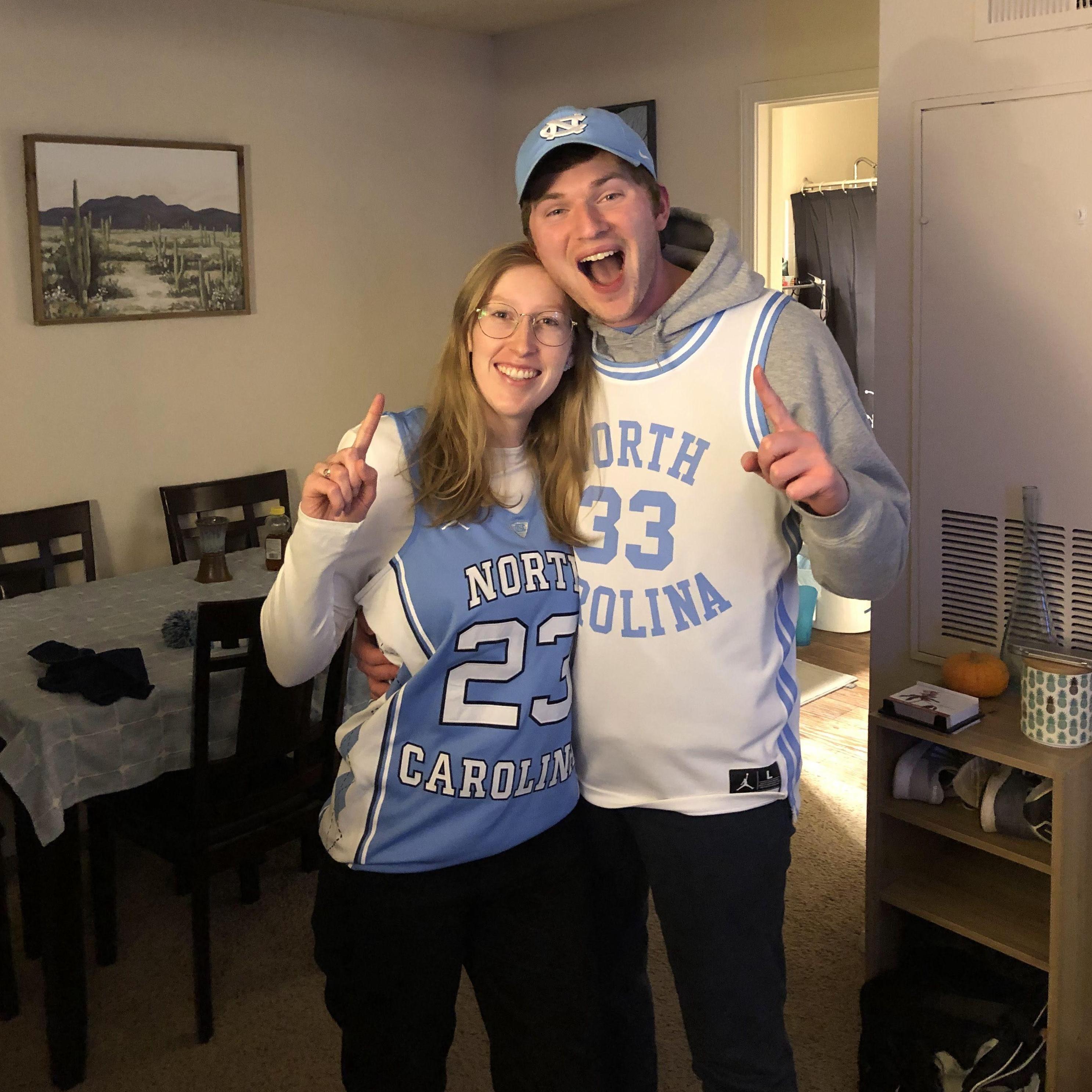 Celebrating UNC men's basketball beating Duke in the 2022 Final Four. Not seen here: the COVID-19 we both caught after watching the national title game in the Dean Dome