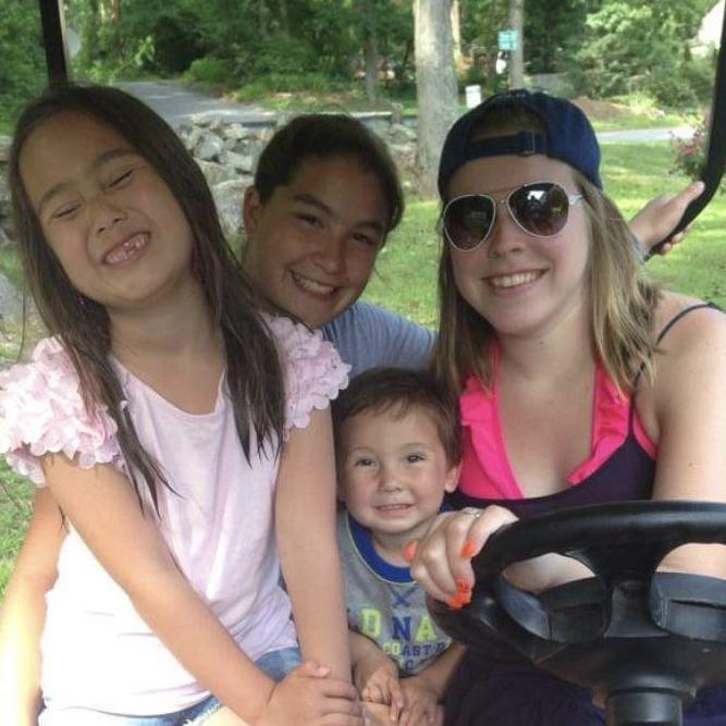 Sophie, Kayla, Carol, & Xander before a golf cart ride