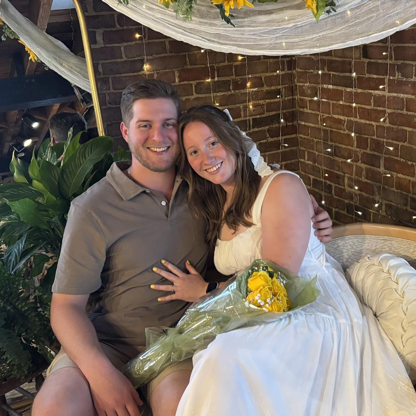 Flowers from the groom and his lovely help opening presents at the bridal shower