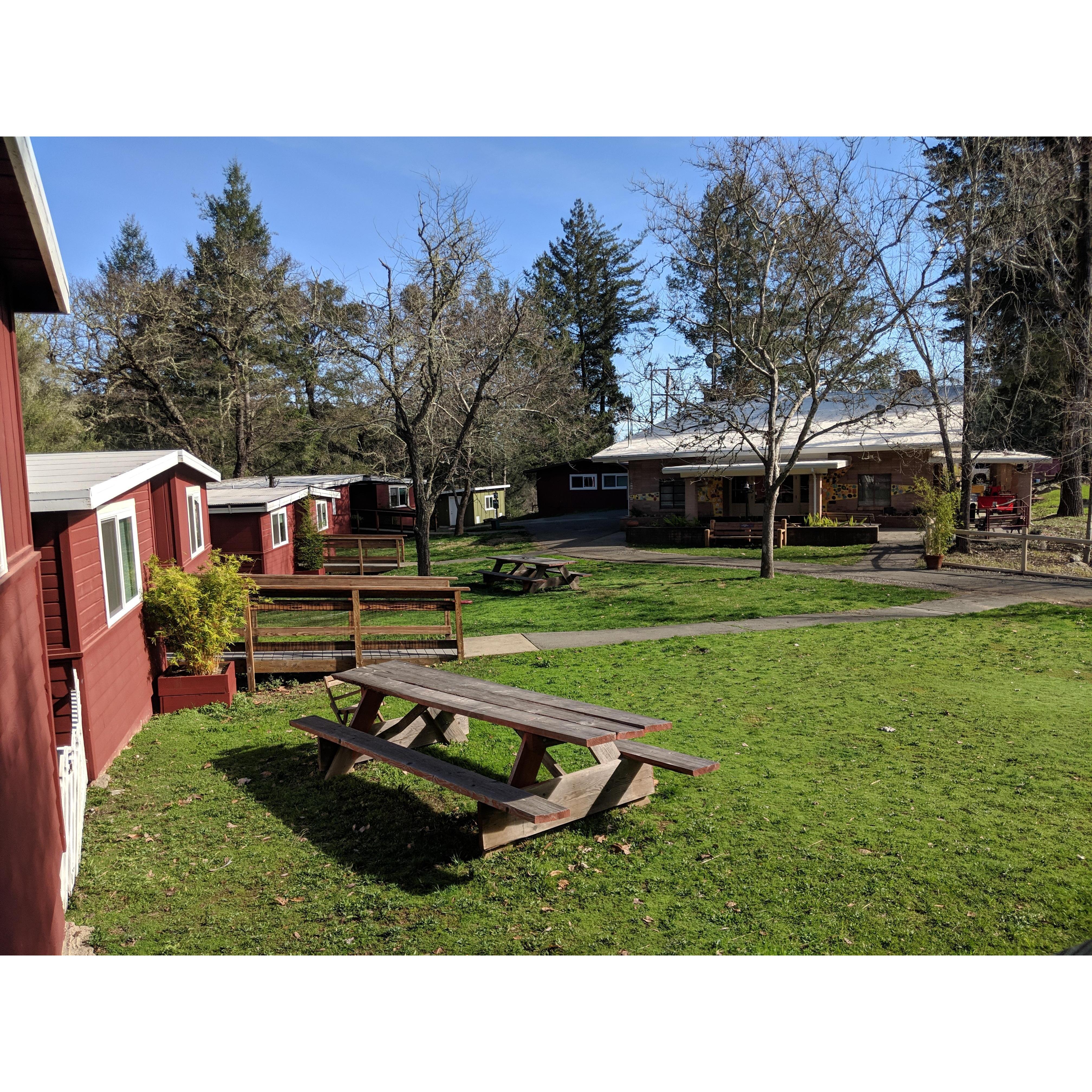 Enchanted Hills Lakeside Cabins with the Dining Hall in the background