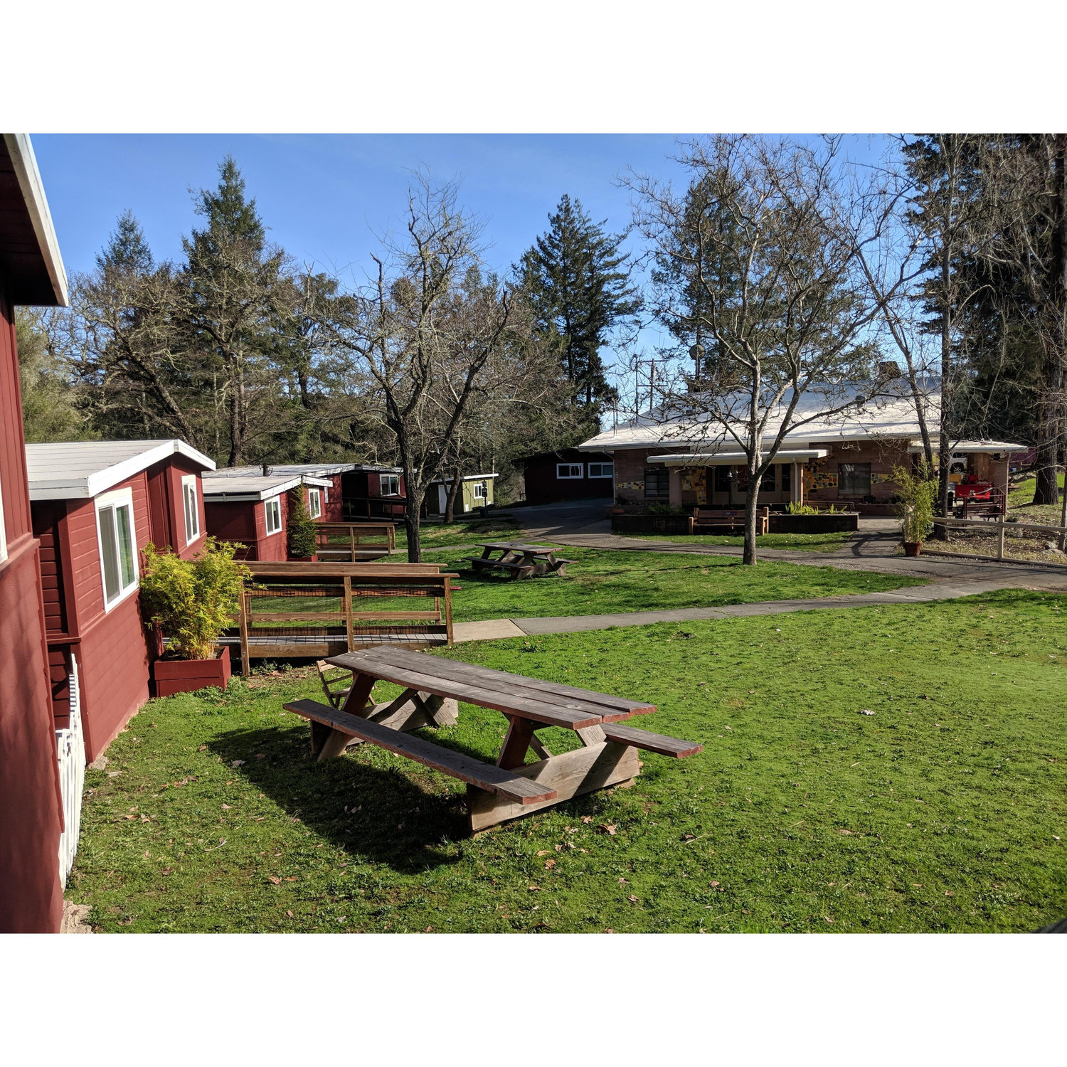 Enchanted Hills Lakeside Cabins with the Dining Hall in the background