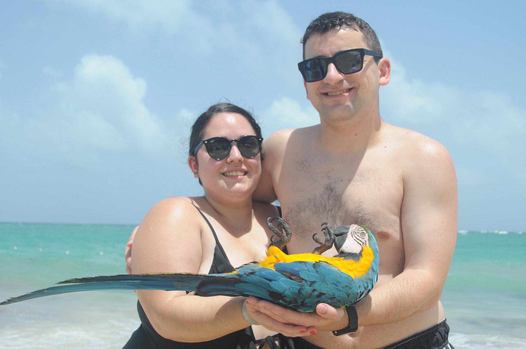 Holding a parrot in the DR. Sandy was scared.