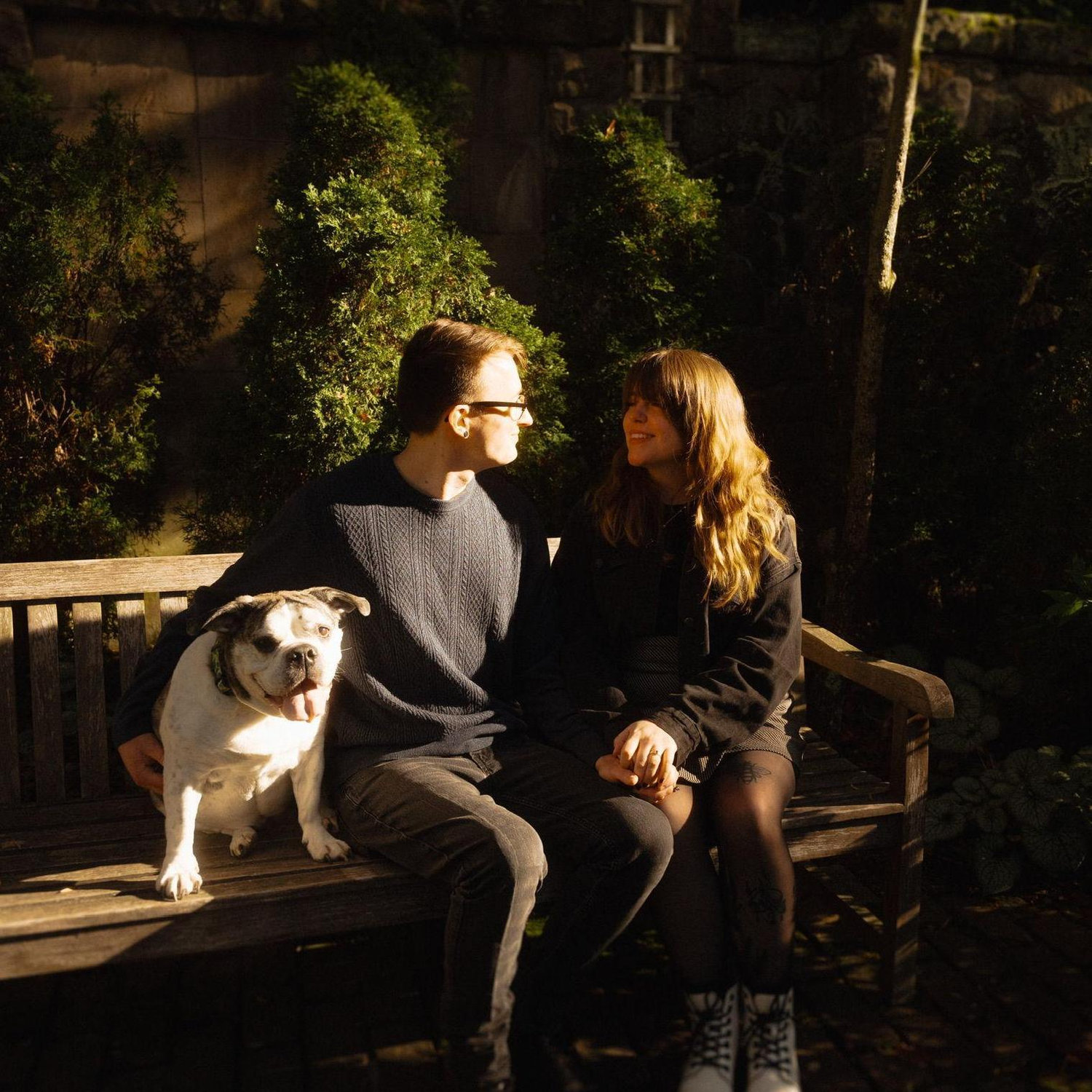 A photo of us and our beloved dog, Lilith, from our engagement shoot.