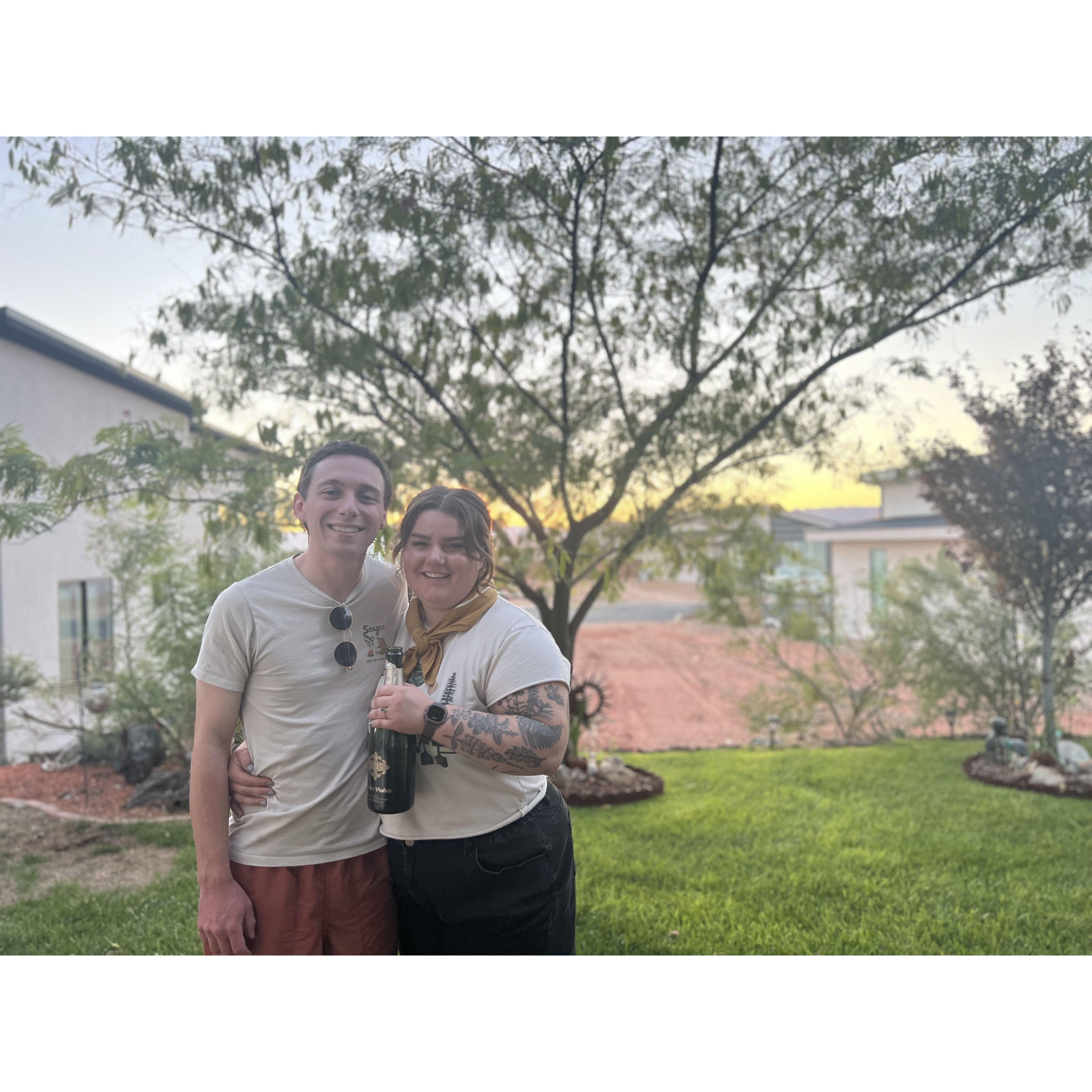 Enjoying champagne after their engagement