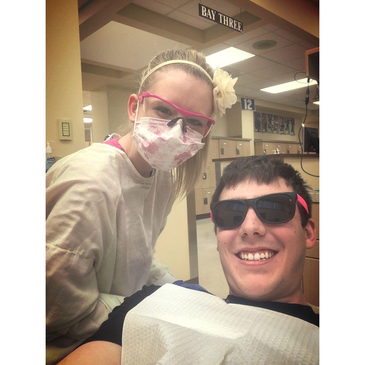 Zac helping Jessica get through dental hygiene school in 2014.