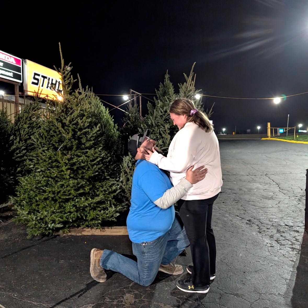 Ian proposed at the Christmas Tree lot we get our Christmas Tree every year— this was our 4th tree we have gotten together!