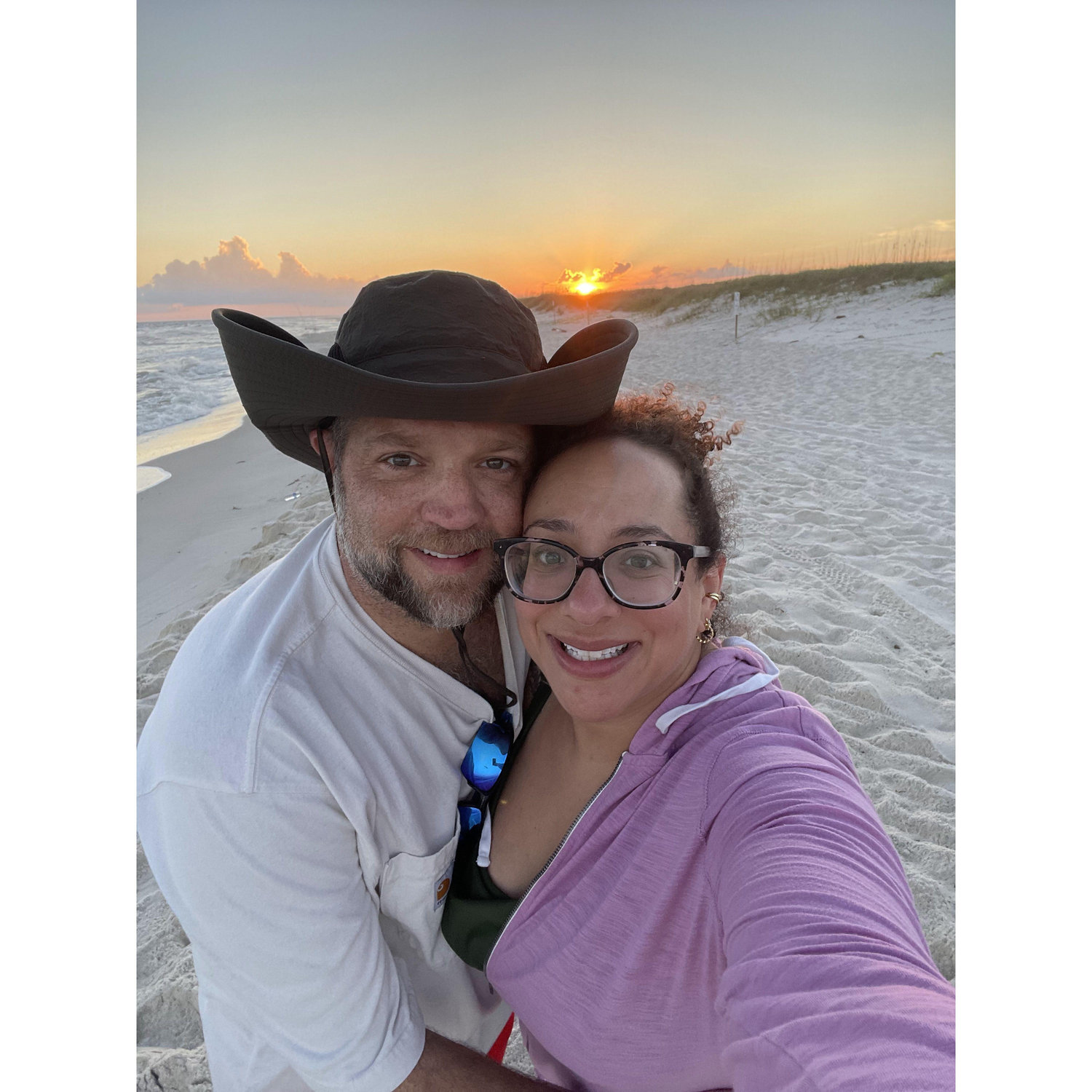 August 2023 - Sunrise fishing on the beach in Gulf Shores. This is one of my favorite pictures of us.