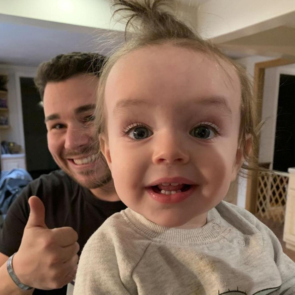 Troy loves being Hallie's God Daddy!