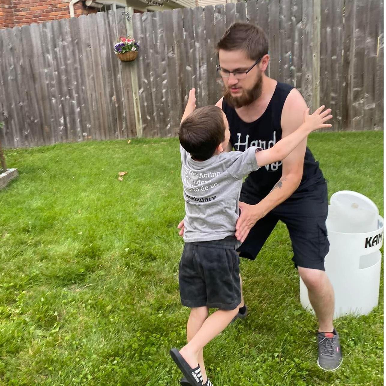 Jack running up to Patrick to be put on his shoulders