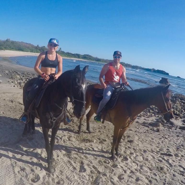 Horseback riding on the beach in Nosara, Costa Rica.