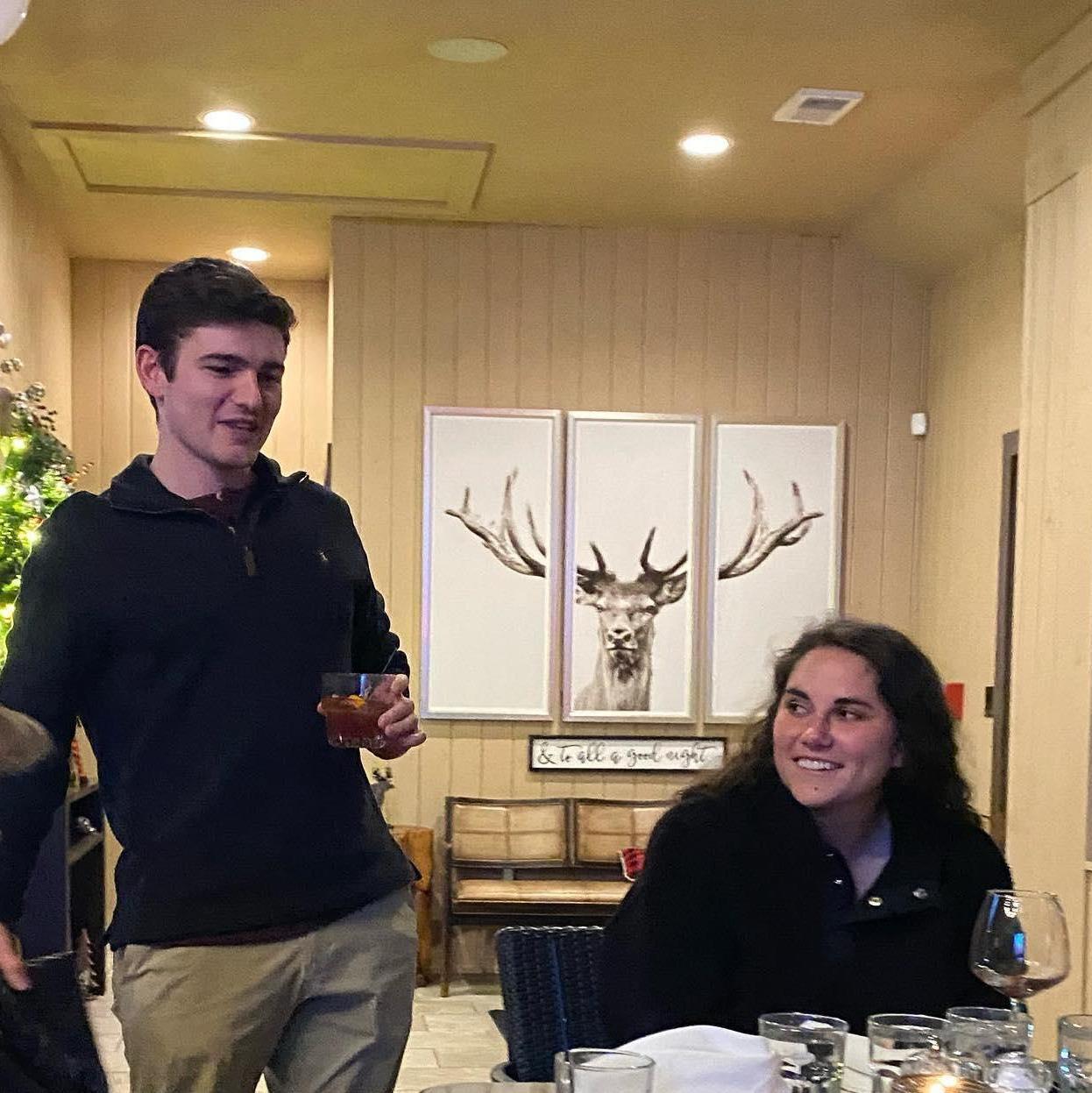 Alexa trying to bear through Logan talking at the engagement party...maybe an indicator of what the wedding weekend will entail