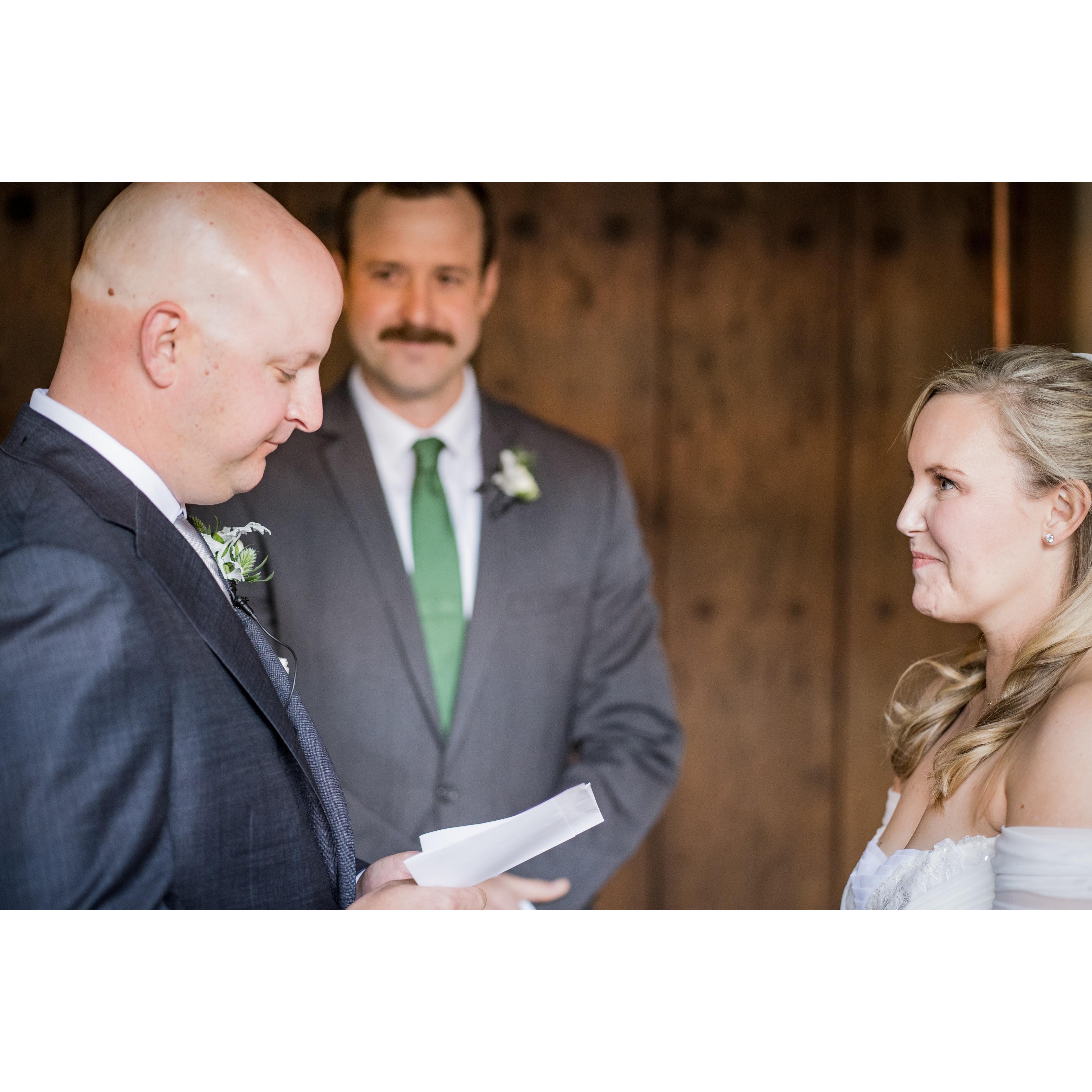 Saying our vows in front of our officiant, Chase Motley.