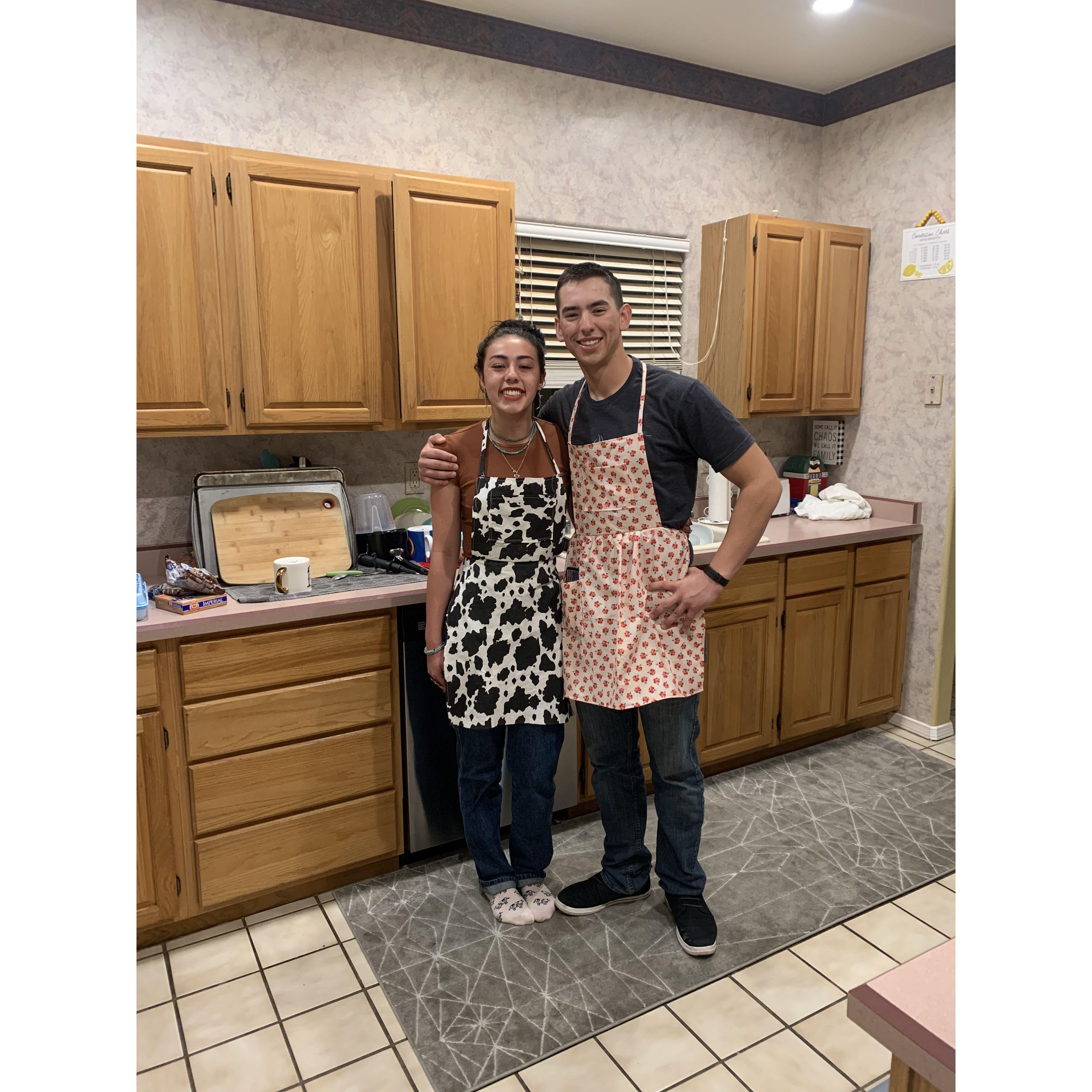 The very first photo we ever took together. This was our first date. We made cookies and danced in the kitchen. Shoot out Sam for getting a picture. Anayah made tanner a girly apron on a dare.