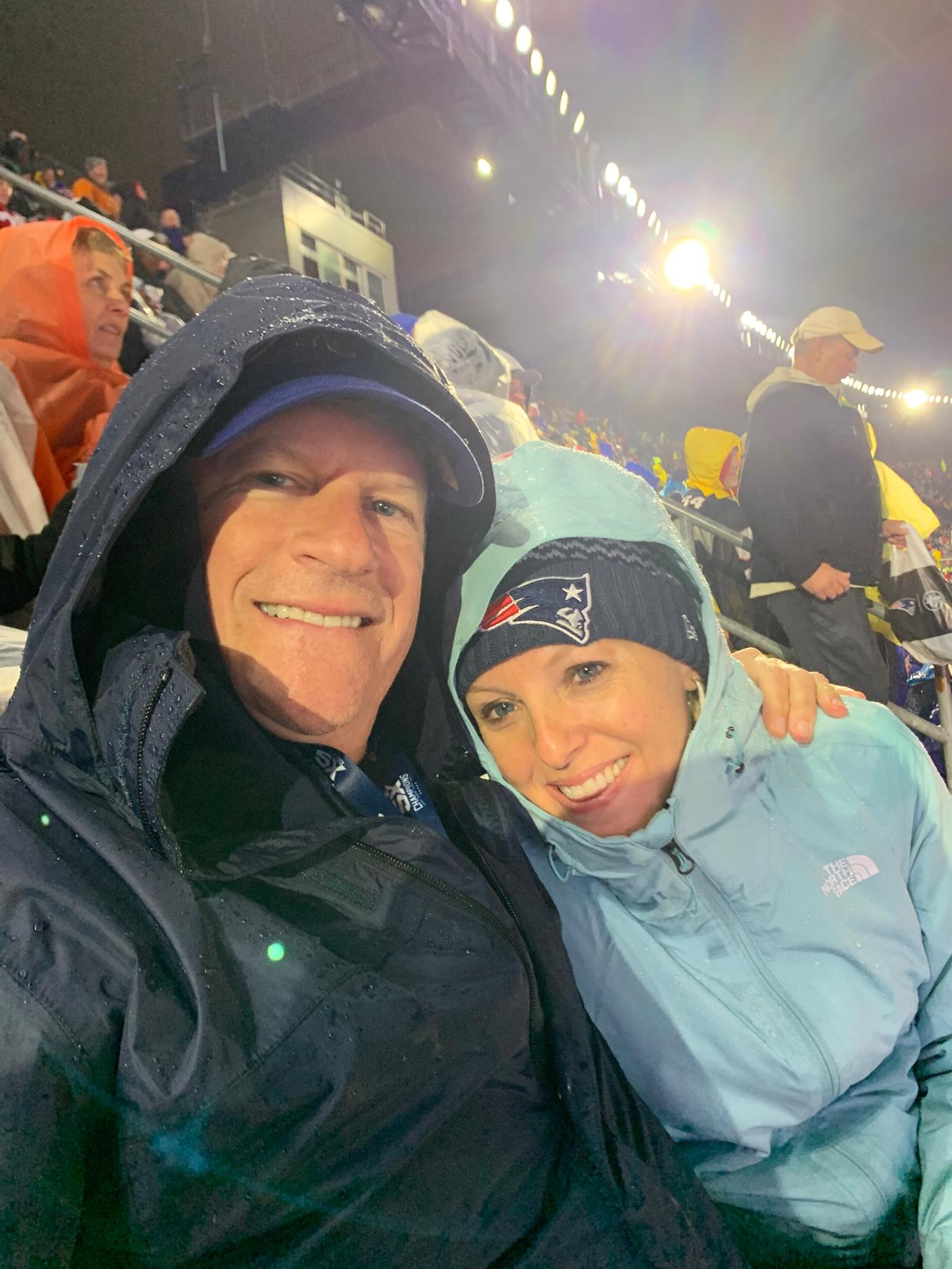Sports fanatic and a chilly, wet somewhat good sport.  Amanda has not been back to Foxboro since.