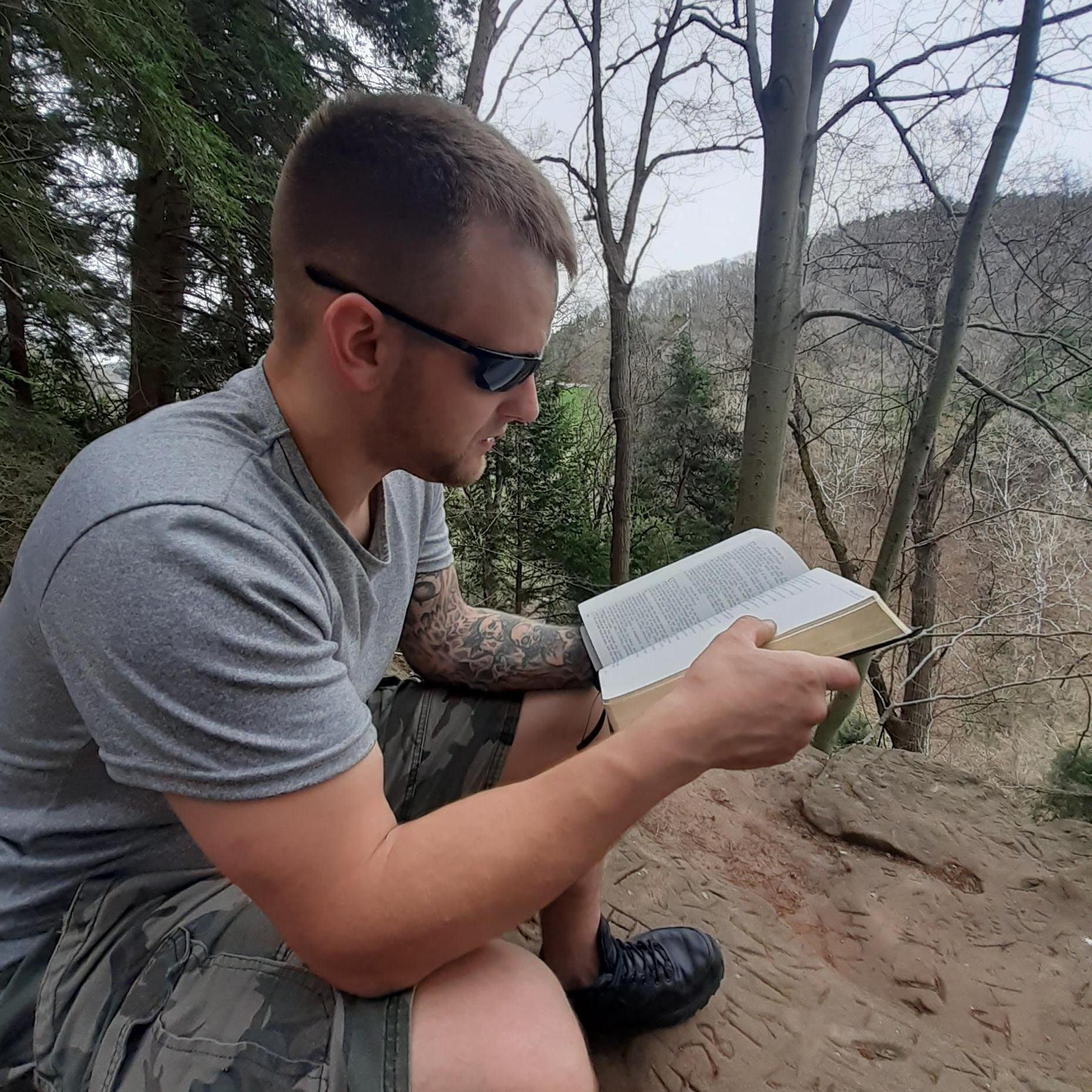 Joe takes his Sword everywhere even hiking! We read on the mountain top.