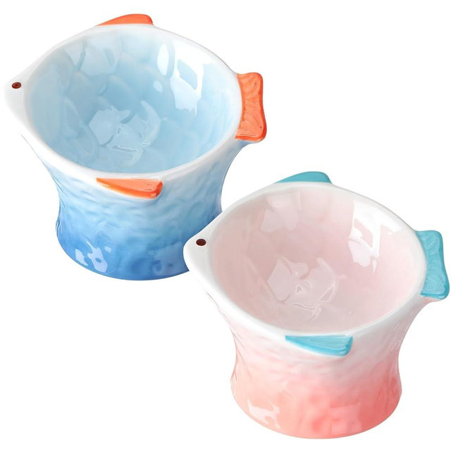 Tioncy 2 Pcs Raised Cat Food Bowl Elevated Shallow Angled Ceramic Cat Bowl Cute Fish Shape Slanted Cat Food Dish Anti Vomiting Non Slip Cat Whisker Fatigue Bowl Tilted Pet Feeder (Blue, Pink)