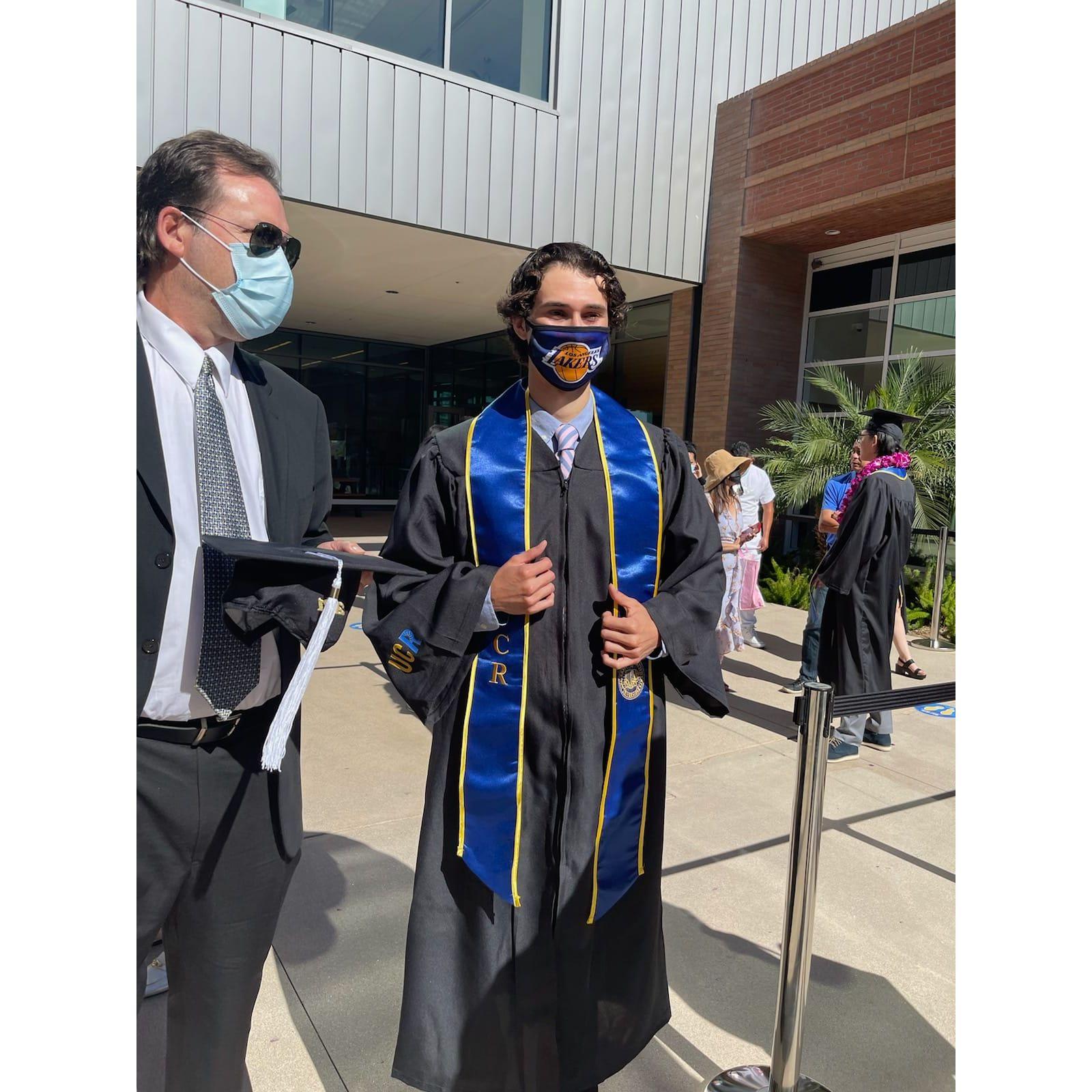 Michael repping the Lakers at his UCR history major human-drive-thru graduation ceremony.