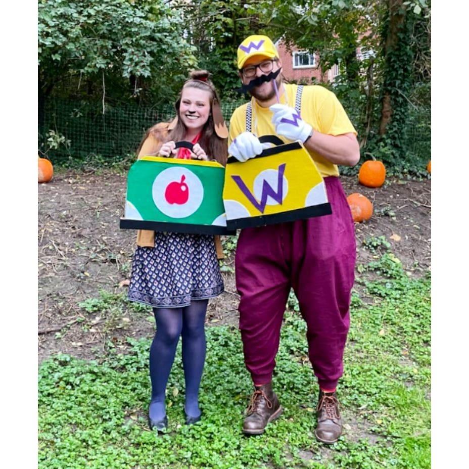 We dressed as our favorite Mario Kart characters for Halloween 2021, complete with cardboard "karts." Abby is Isabelle from Animal Crossing and Cory is Wario from the Mario franchise.