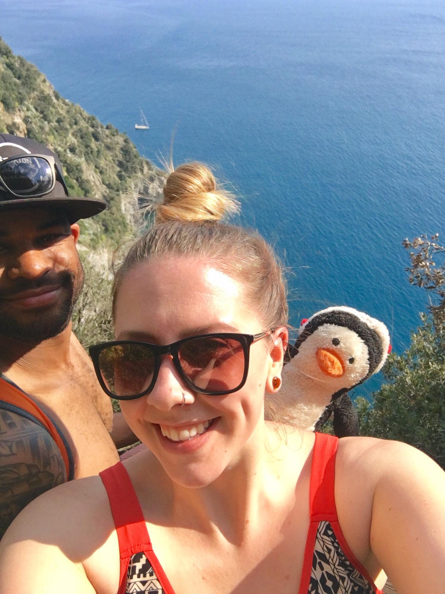 Hiking in Cinque Terra Italy with our penguin pal Oswald