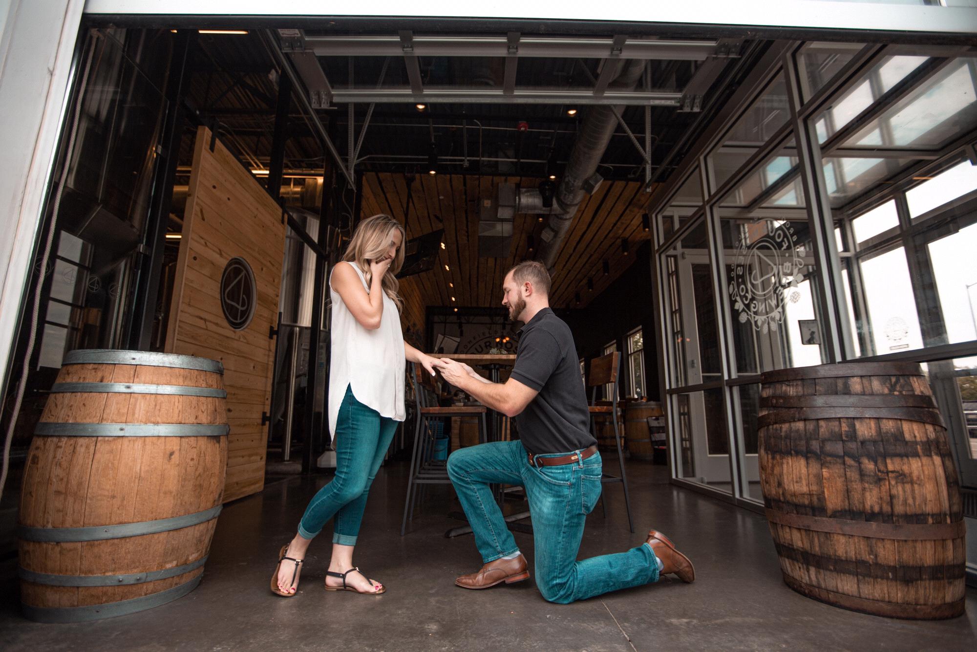 We reenacted the proposal in front of the table where we sat for our first date!