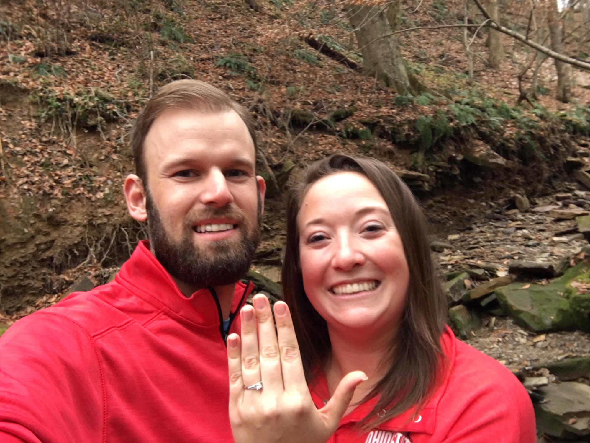 Kevin proposed while they were on a walk in the hollow at the farm the day after Thanksgiving. The matching shirts is only because this was shortly after the family took their annual Ohio State photo