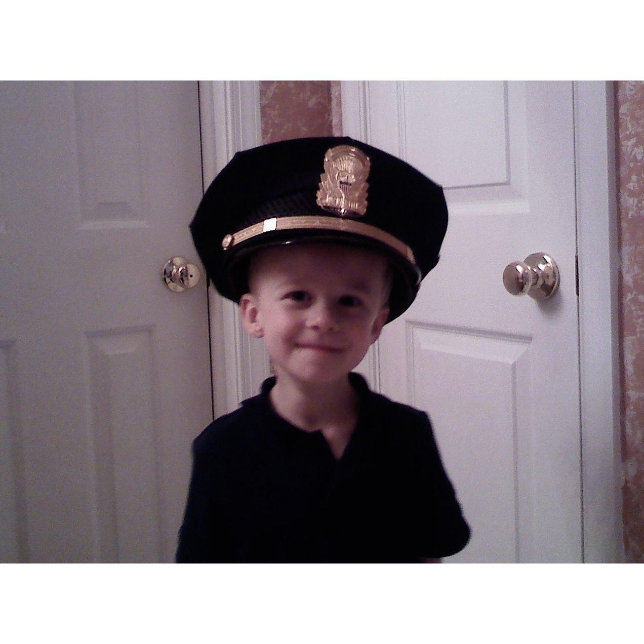 Aidan trying on his Dad Secret Service police hat!