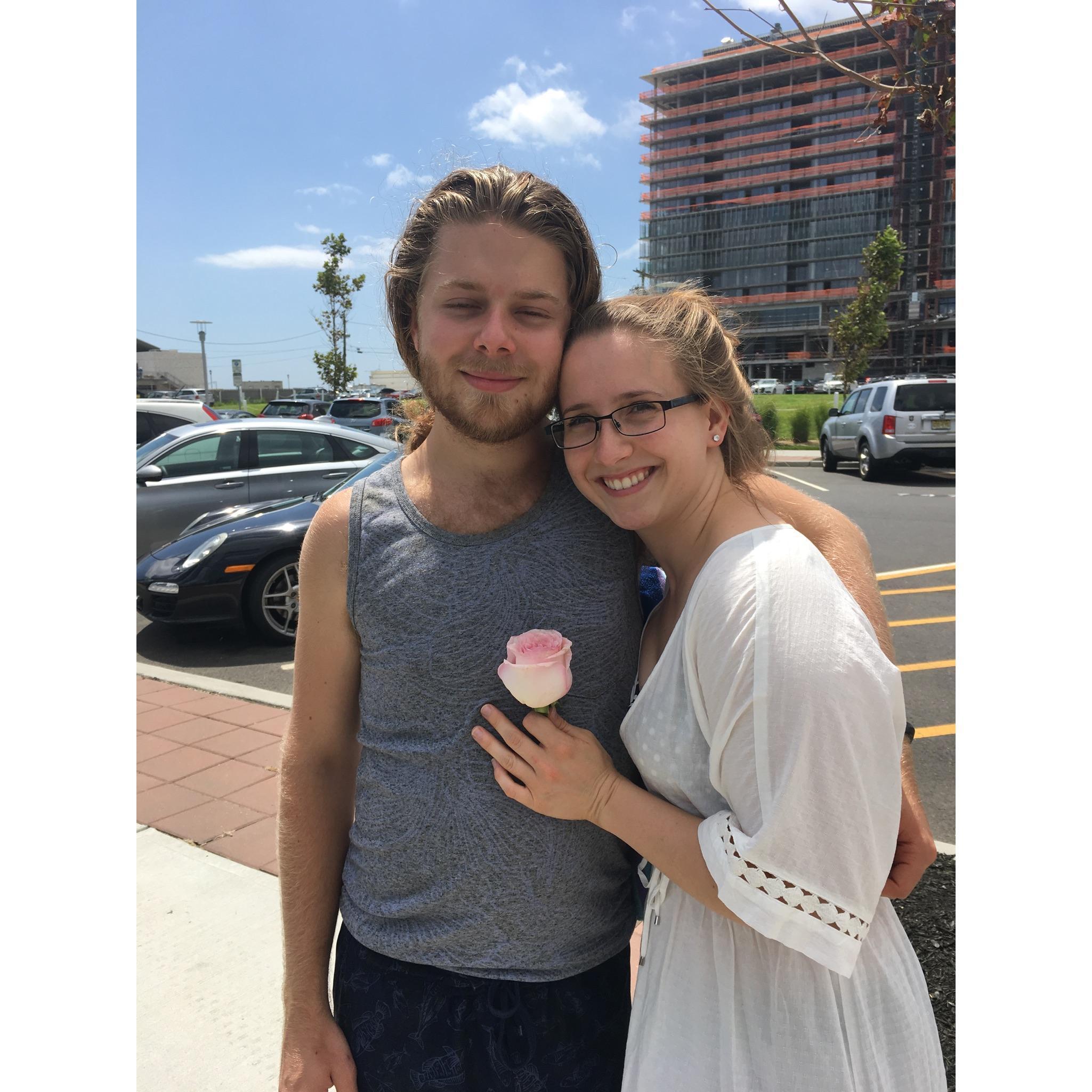 I found this "road rose" hanging out in a parking lot. Despite it being a bit silly, Kaitlin still loved the spontaneous rose. (Jersey Shore, July 2018)