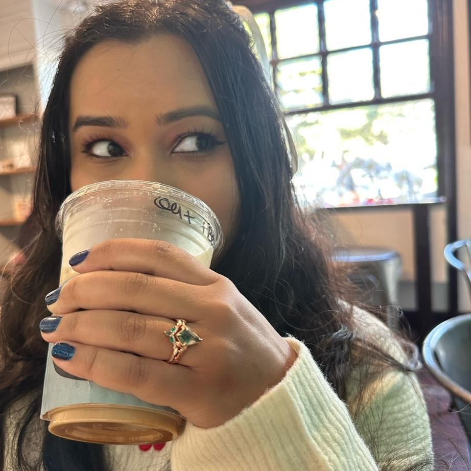 Showing off her fantasy/fairytale ring. What a show off..