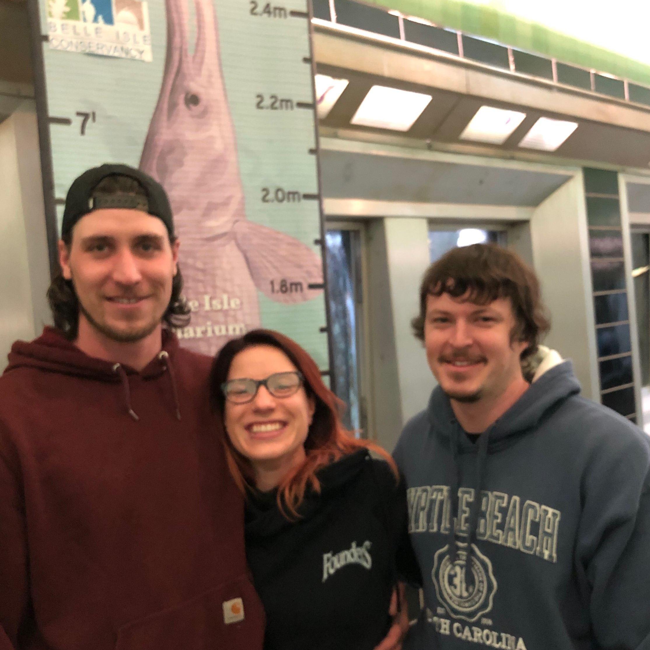 Enjoying the aquarium with my brother
