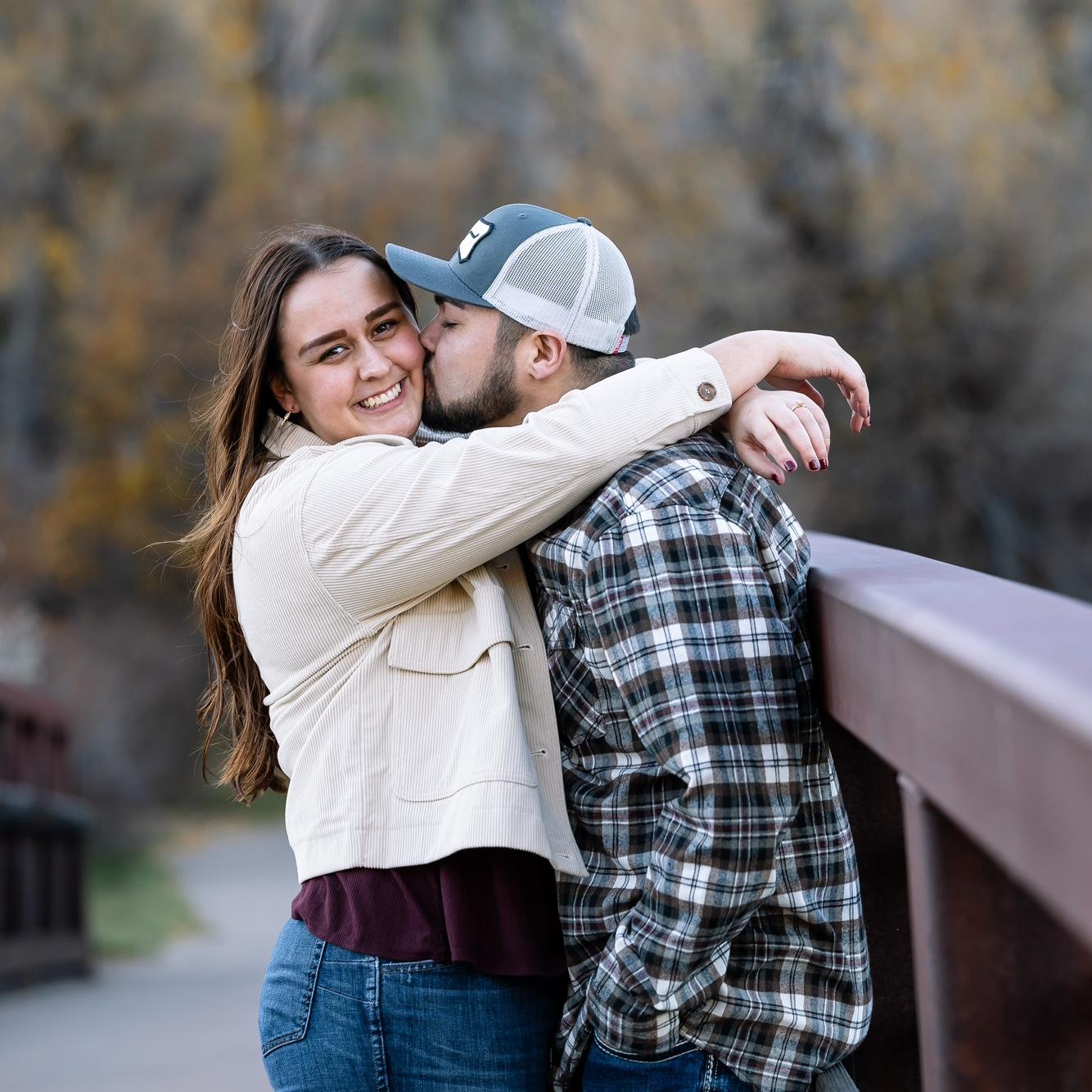 Cheesin' because he PUT A RING ON IT