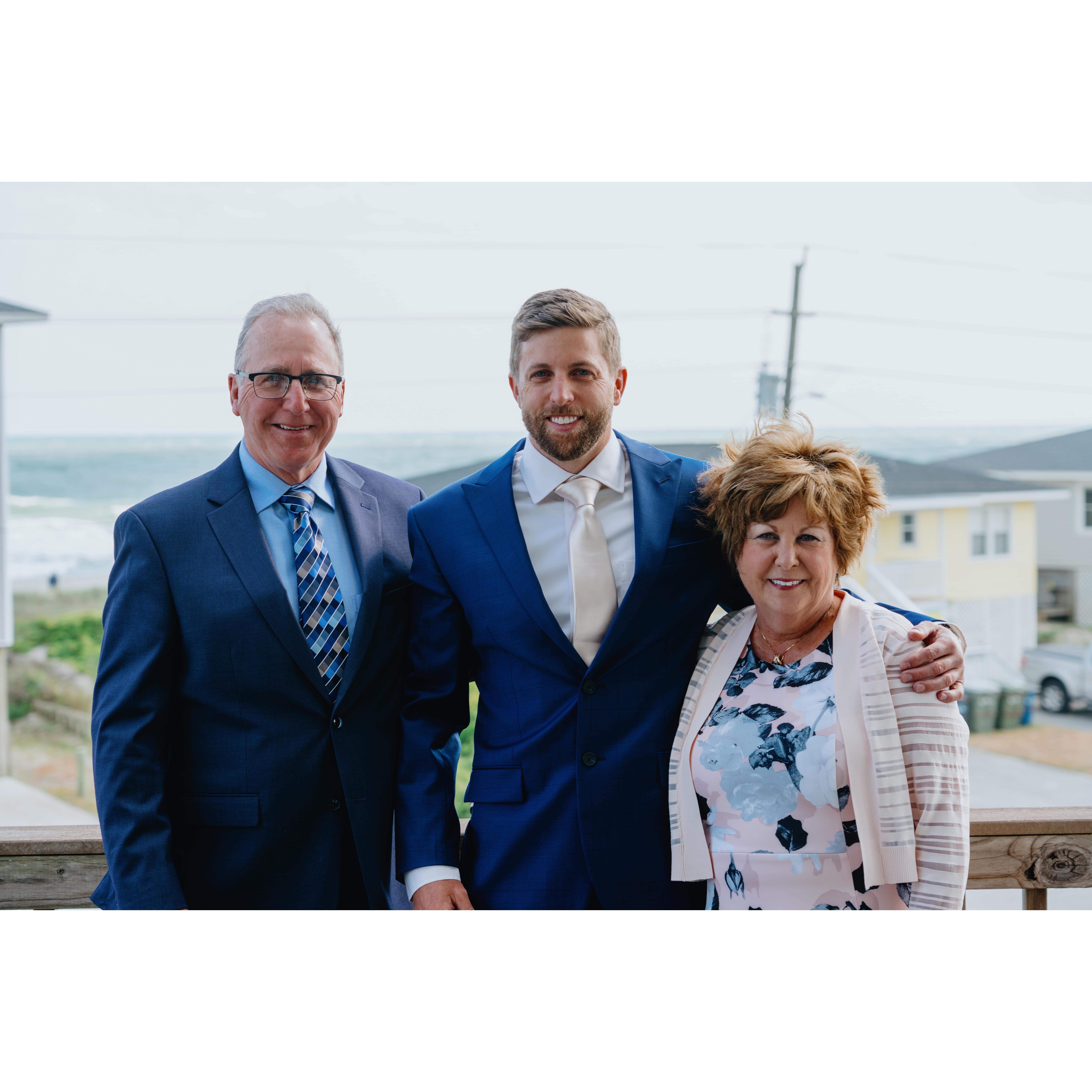 Mark and his parents, Robert and Diane