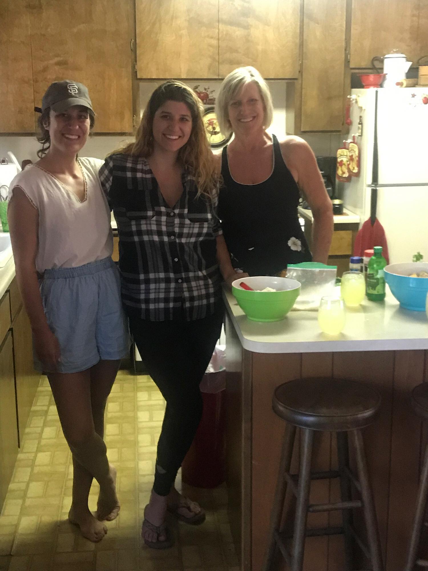 Conner's sister, Marina, and Conner's mother making food at their family Cabin