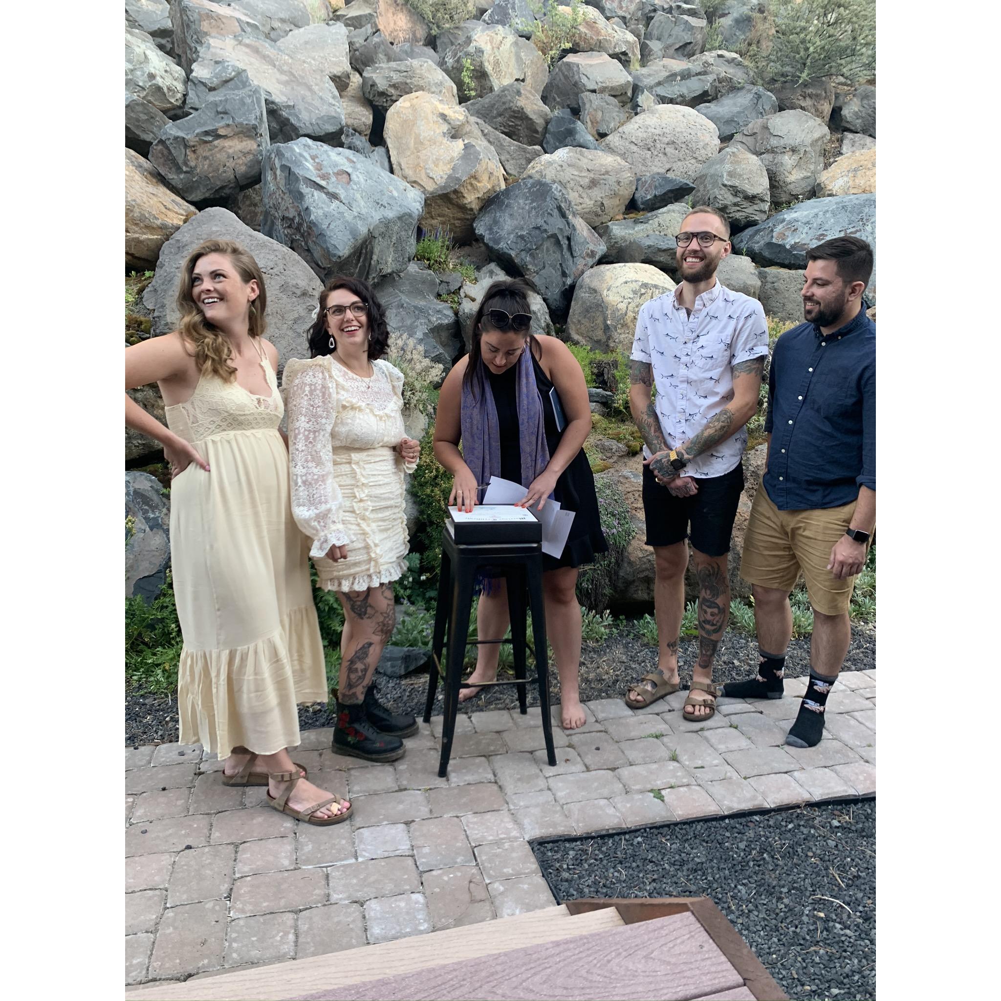 Left to right: Hayley (MOH), Sara, Laura (minister), Tyler, & Tyler (BM) signing the marriage certificate.