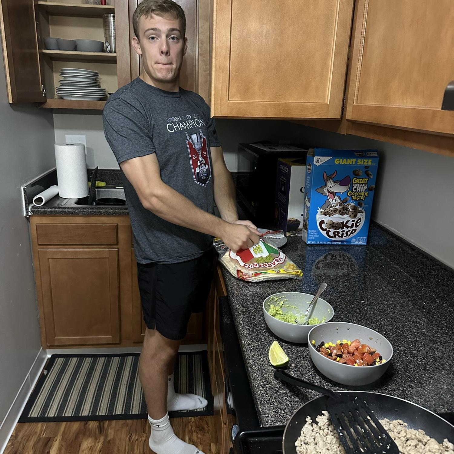Making dinner together in Danny's first apartment in Cbus. Now when our schedules line up we love to try new recipes together.