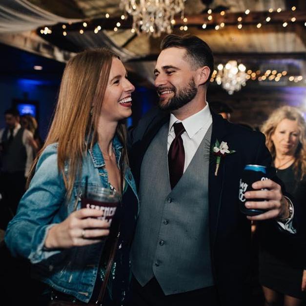 Celebrating friends at a wedding.