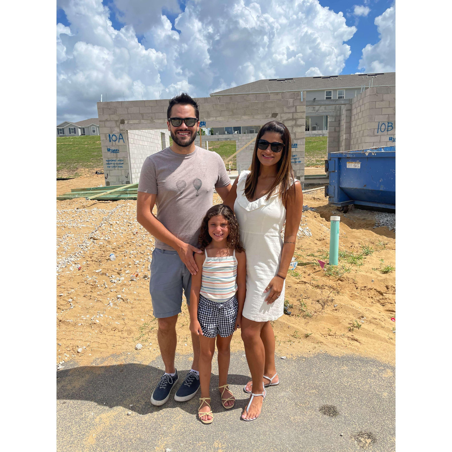 Our perfect family at the construction site of our new home! It is projected to be finished September just before our wedding.