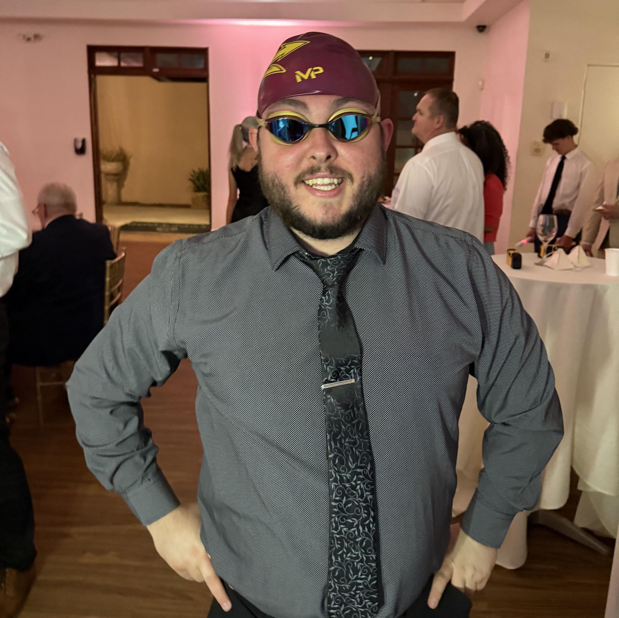 Only at a wedding between an Olympic swimmer and a collegiate triathlete would Trevor find goggles and a helmet in the photo booth! - Phoenix