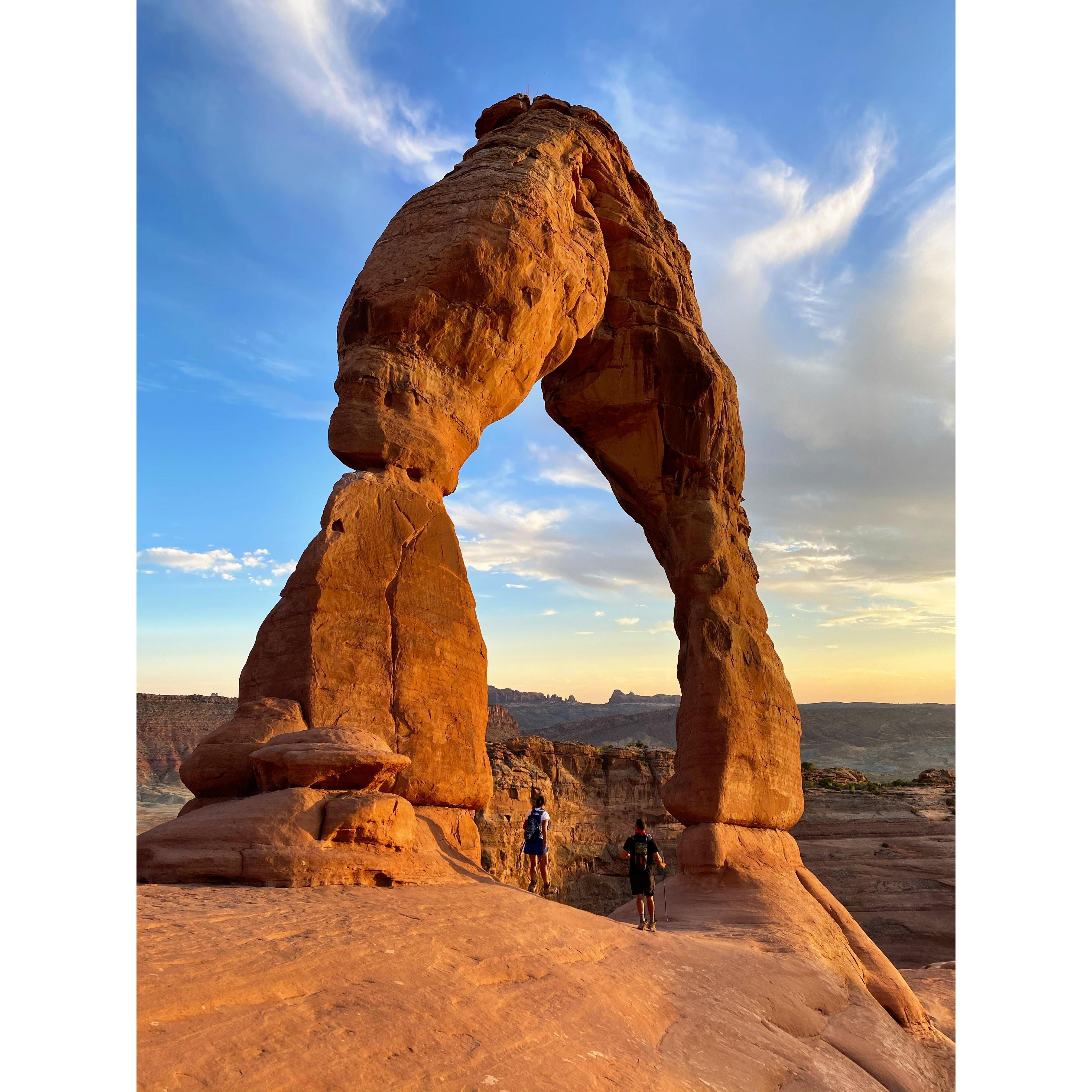 Back on the road again! Passing through Delicate Arch at Sunset in Moab, Utah