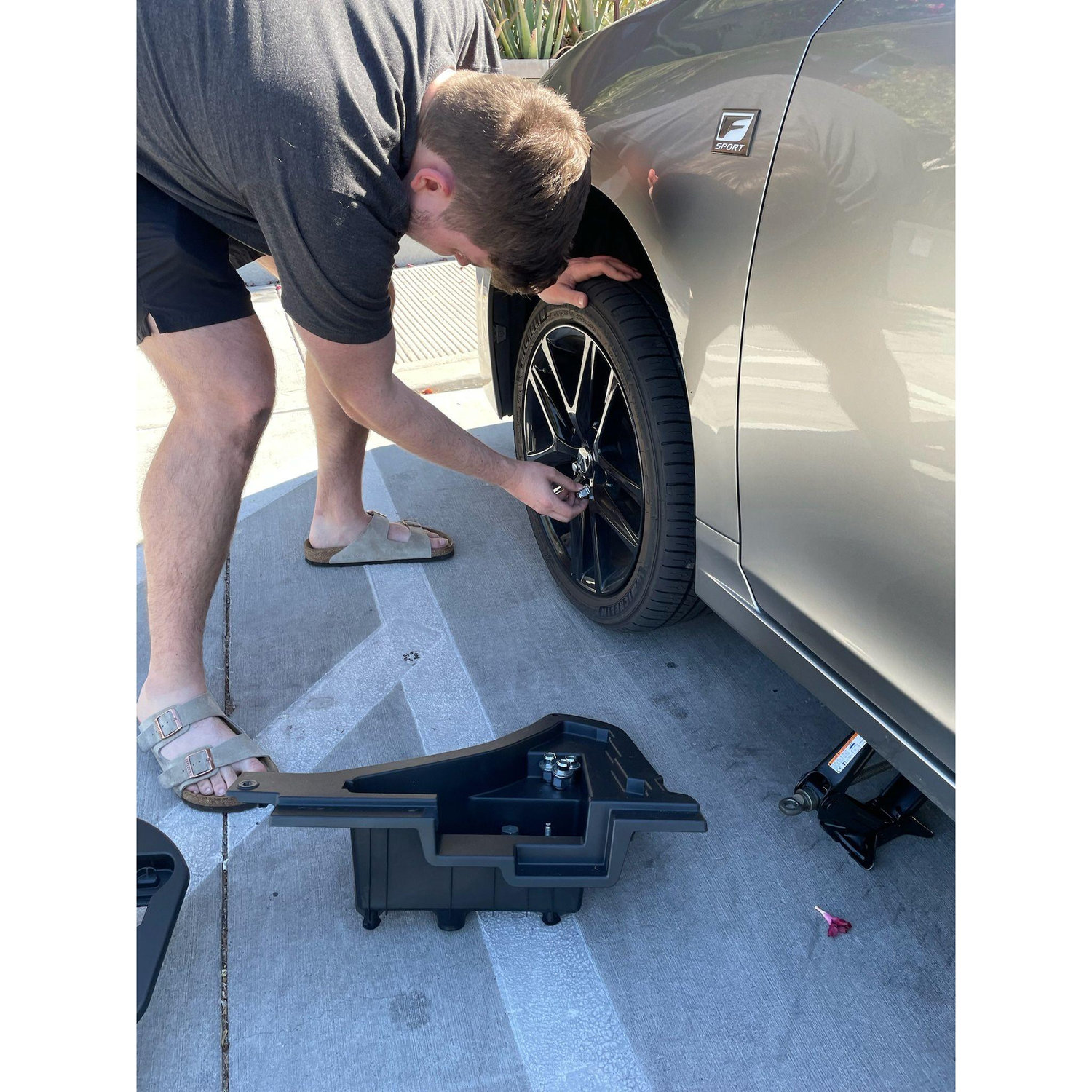 Don changing Regan's flat tire (it was a nail!)