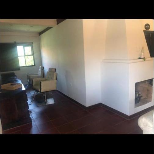 The women's getting ready room has a makeup and hair station with two chairs and a large mirror.