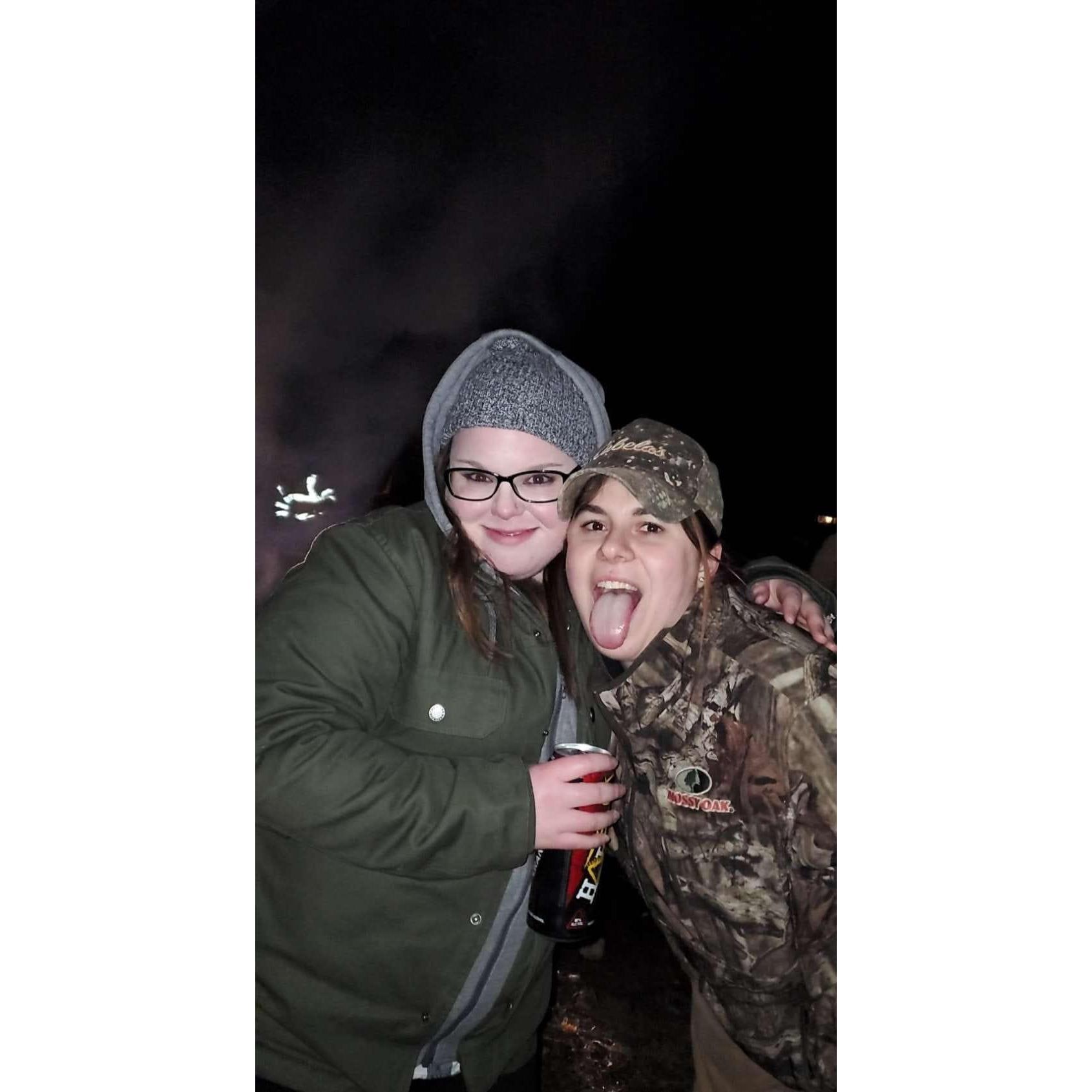 Just some sisters having some fun at a bonfire!
