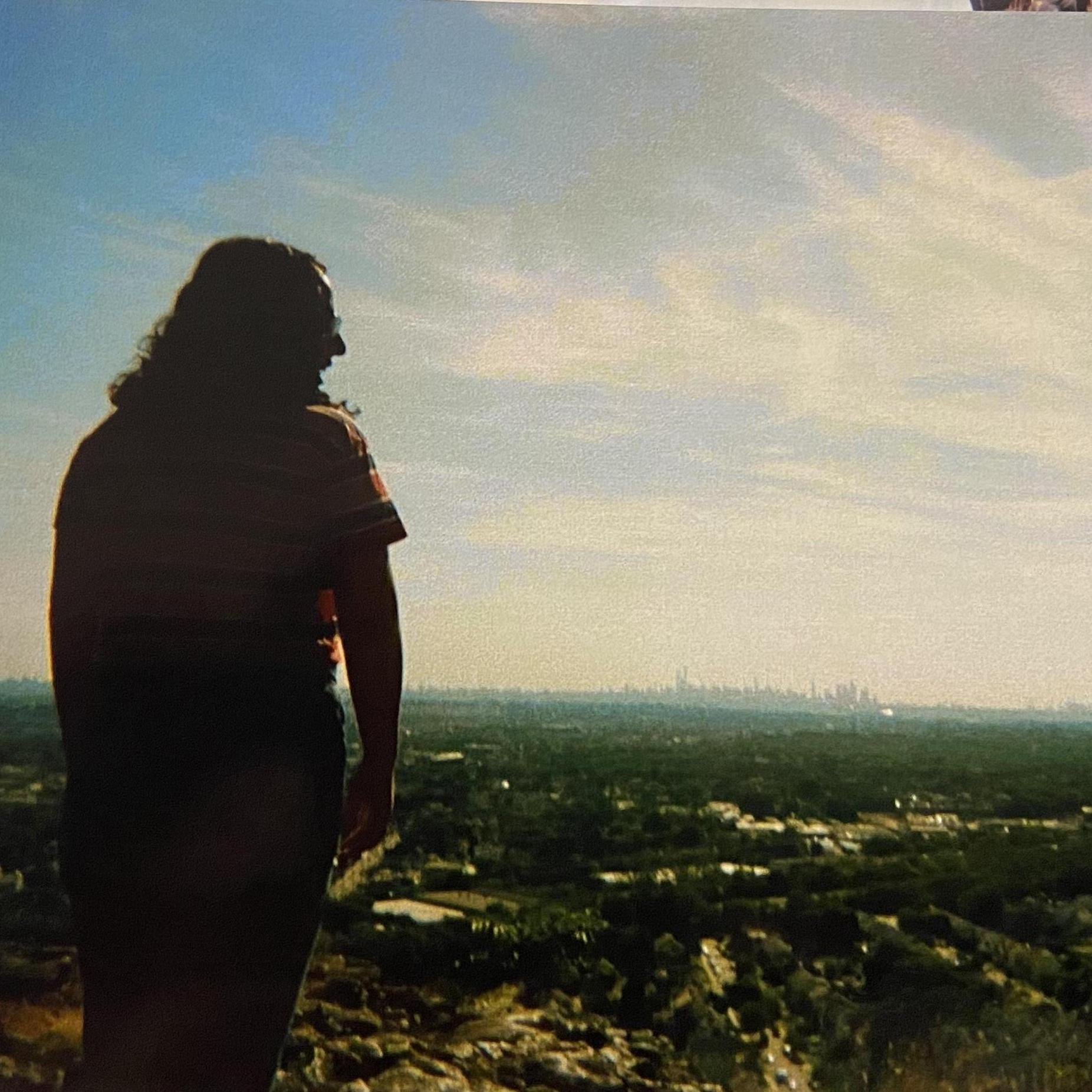 He said he wanted to take a photo of me looking out at the view. He was taking awhile to take the photo so I began to turn around to ask what was going on.