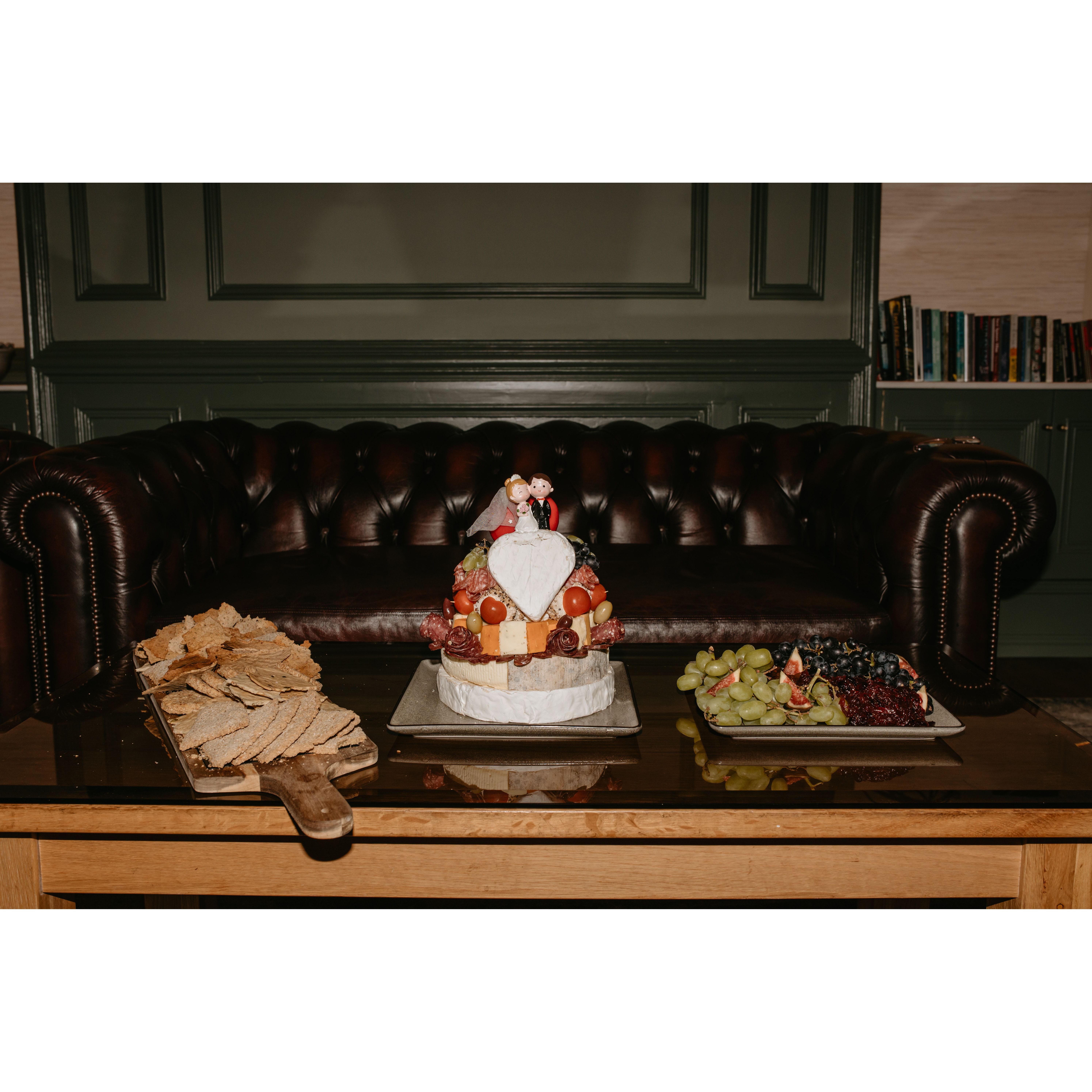 When we first met, Chris said that he didn't like dessert...so instead of a traditional cake, we did a CHEESE cake! Peep the cake topper...another detail from Anna!