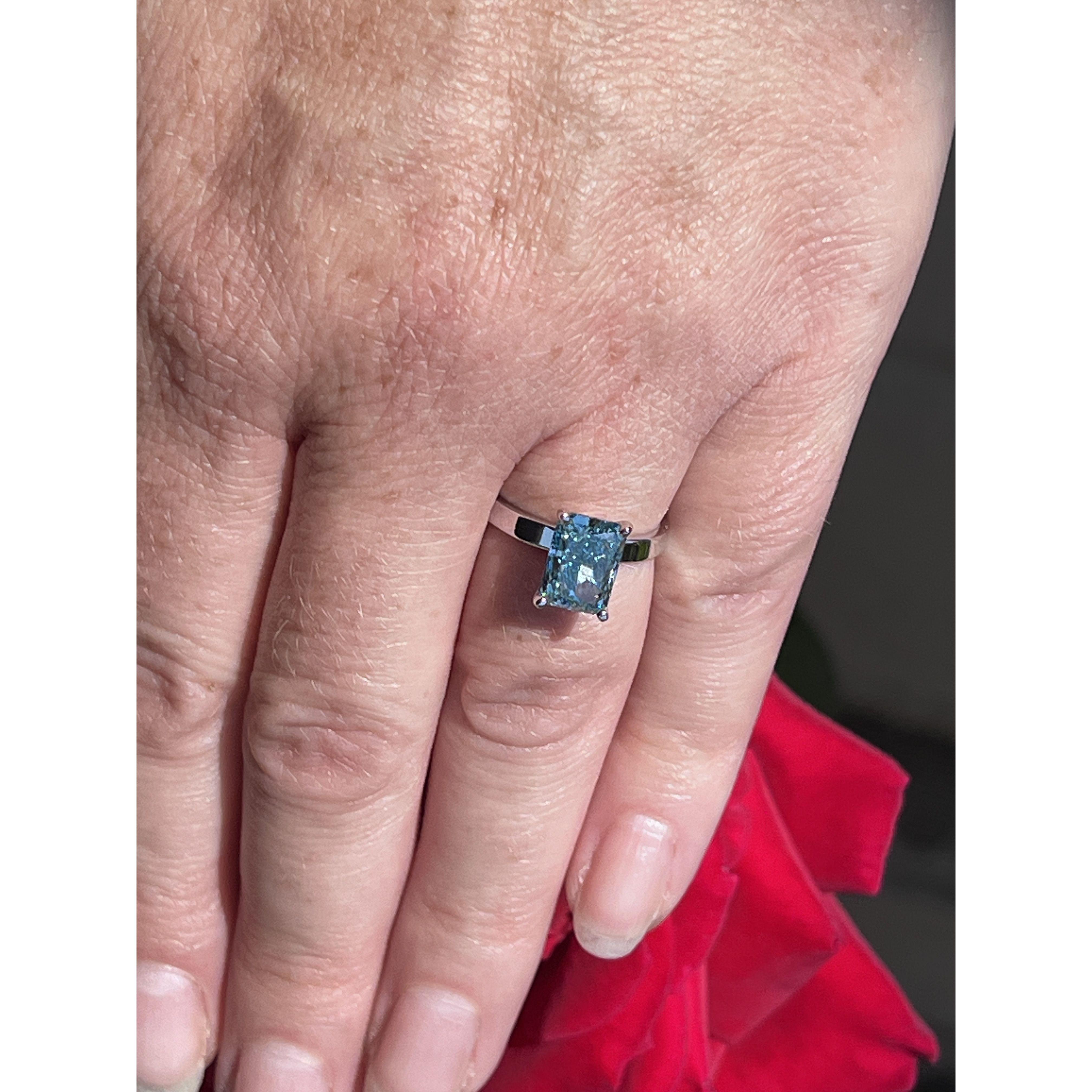 Jon and Felise both love the beach, and the color blue. What better way to encapsulate their love than a blue diamond engagement ring! The color of happiness 🩵