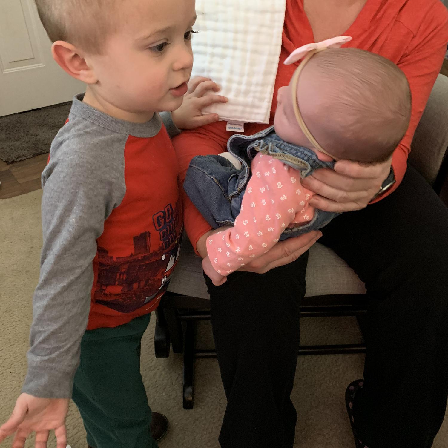 Joining the cousin crew with Vance! He was putting stickers on her overalls. So precious!